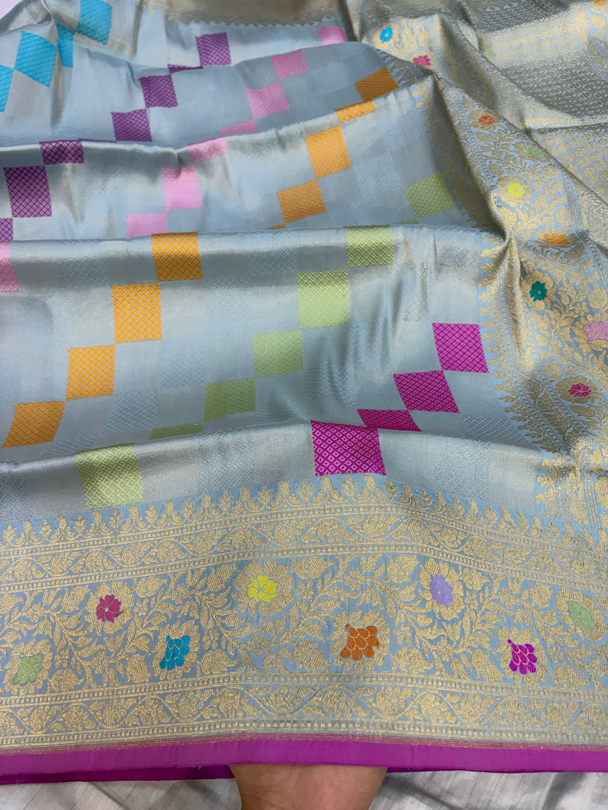 Pure katan tissue silk saree in powder blue colour with multiple meenakari work