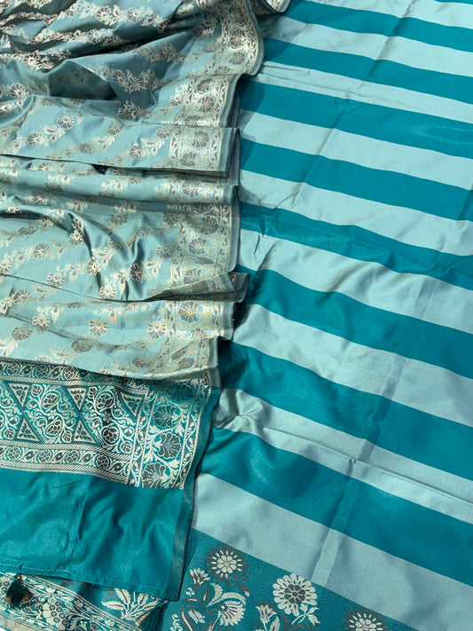 Banarasi soft silk suit in teal blue  with ice blue colour combination with tussels