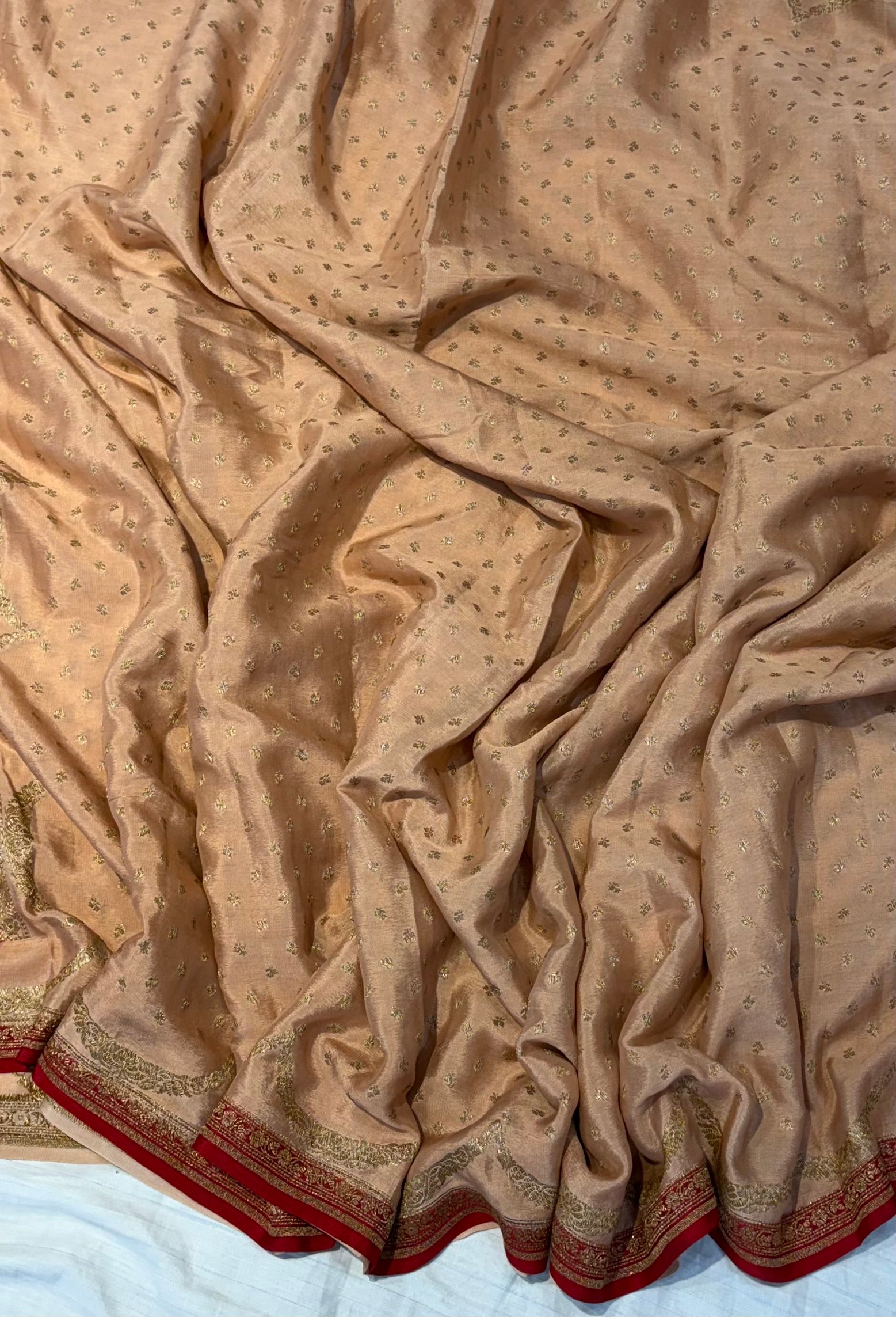 Pure khaddi crepe silk saree in Peach with Red colour