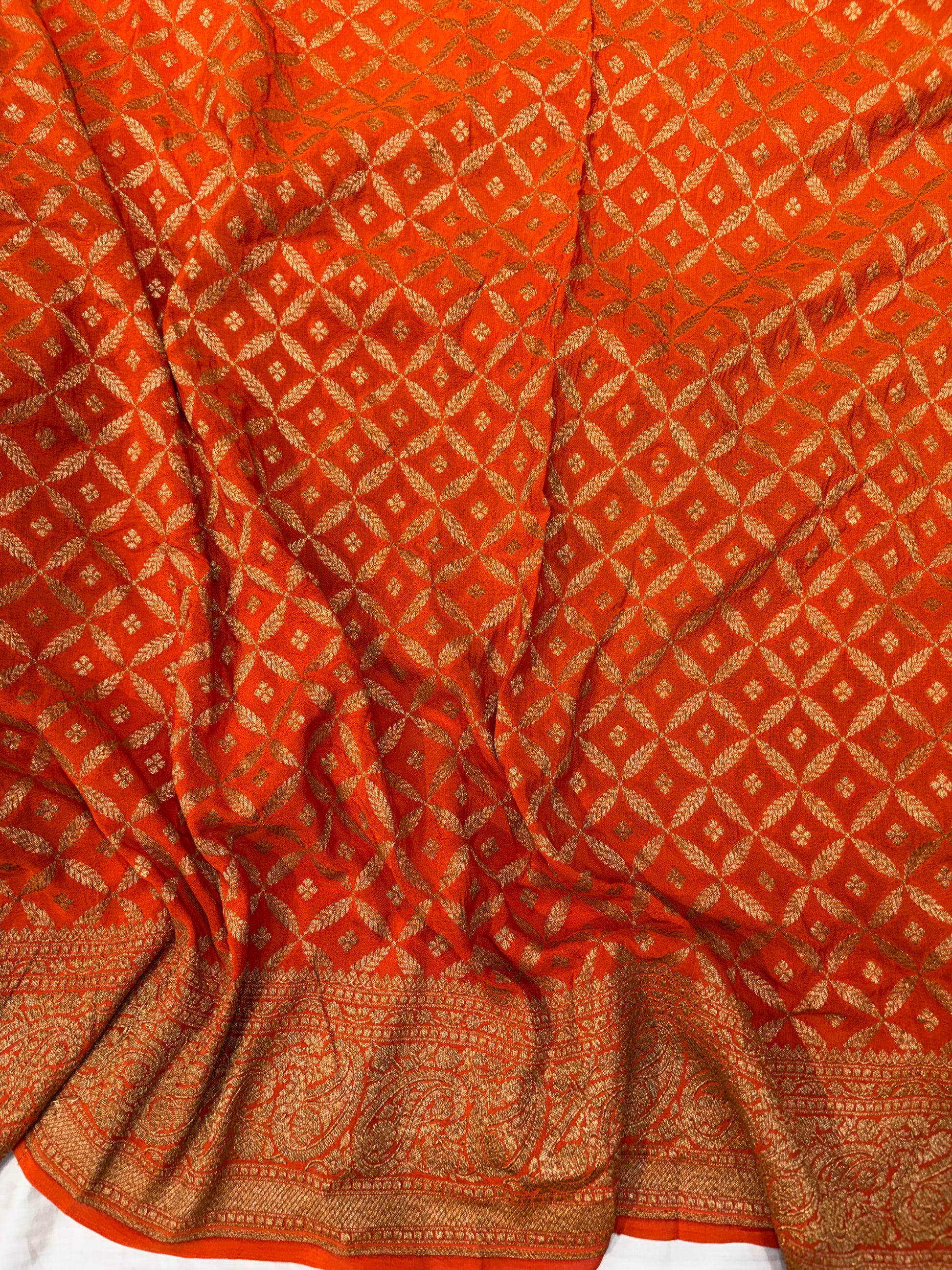 Pure khaddi crepe silk saree in bottle green bright orange colour