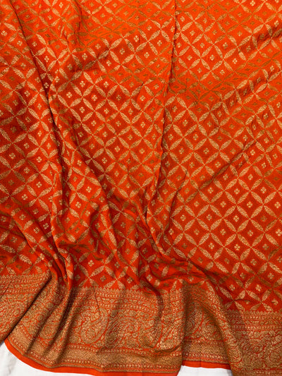 Pure khaddi crepe silk saree in bottle green bright orange colour