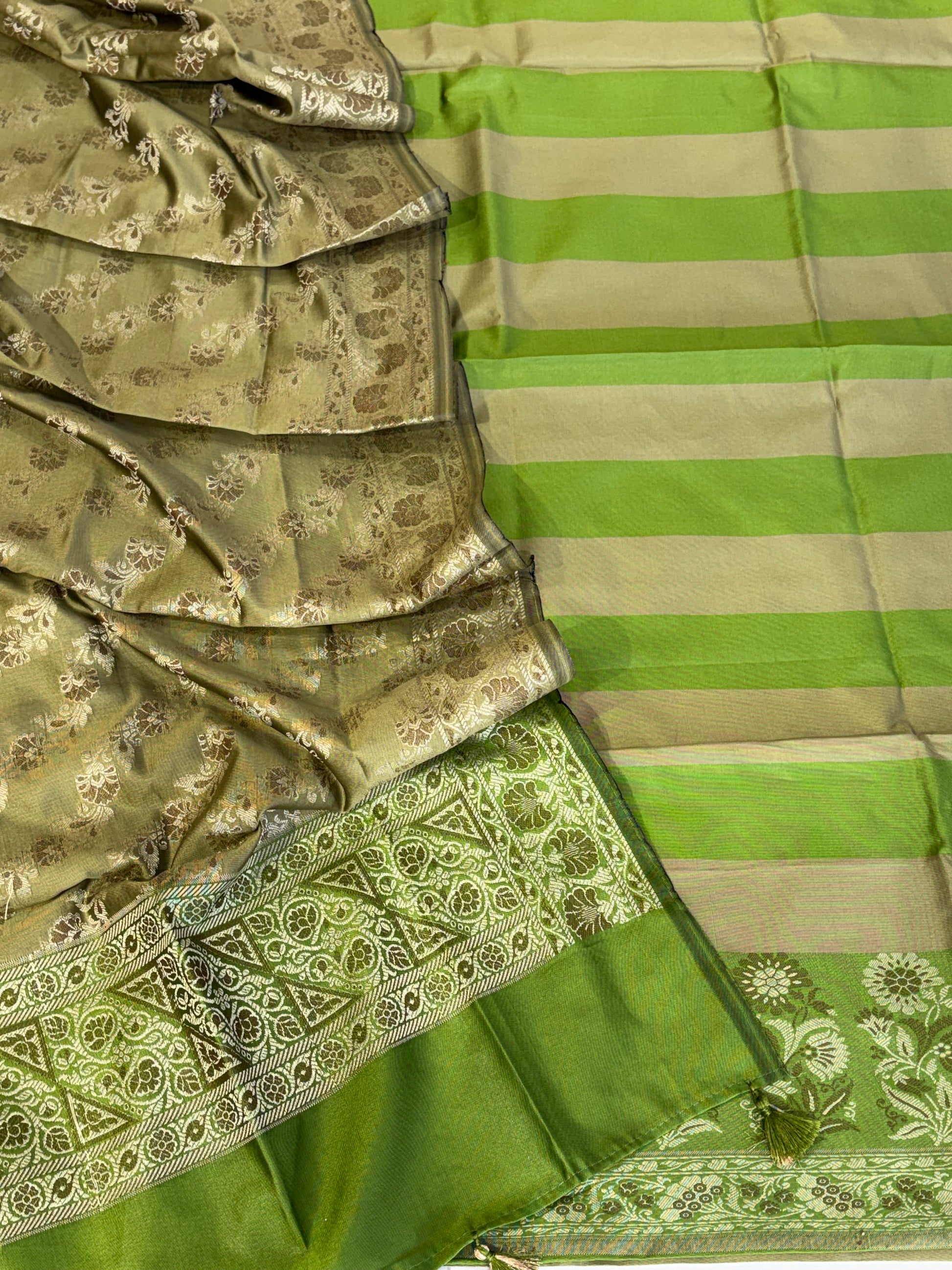 Banarasi soft silk suit in parrot green with olive colour combination with tussels