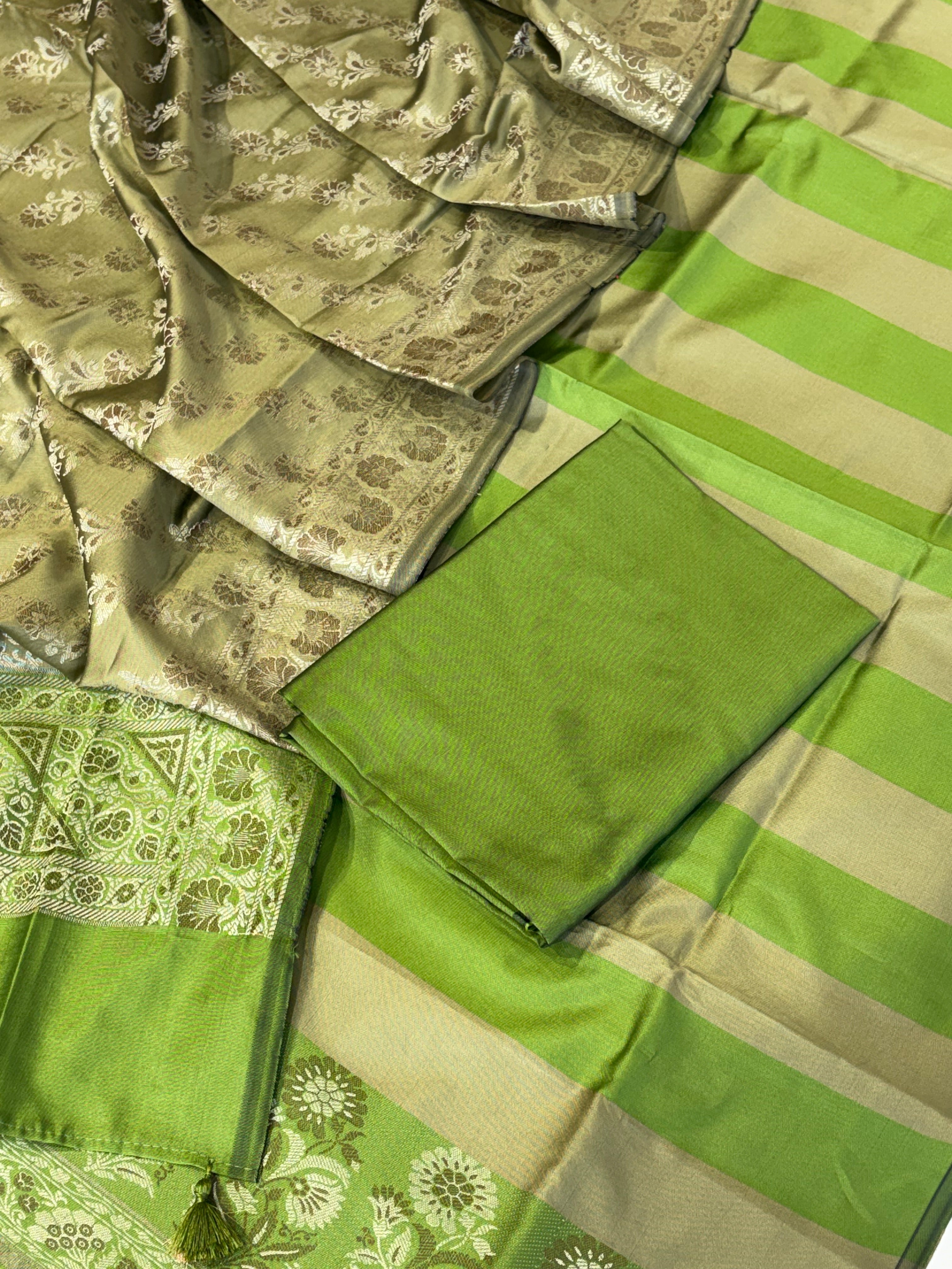 Banarasi soft silk suit in parrot green with olive colour combination with tussels