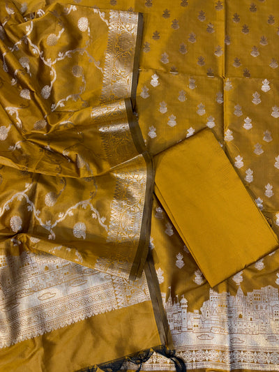 Banarasi soft silk suit in gold colour with temple design work