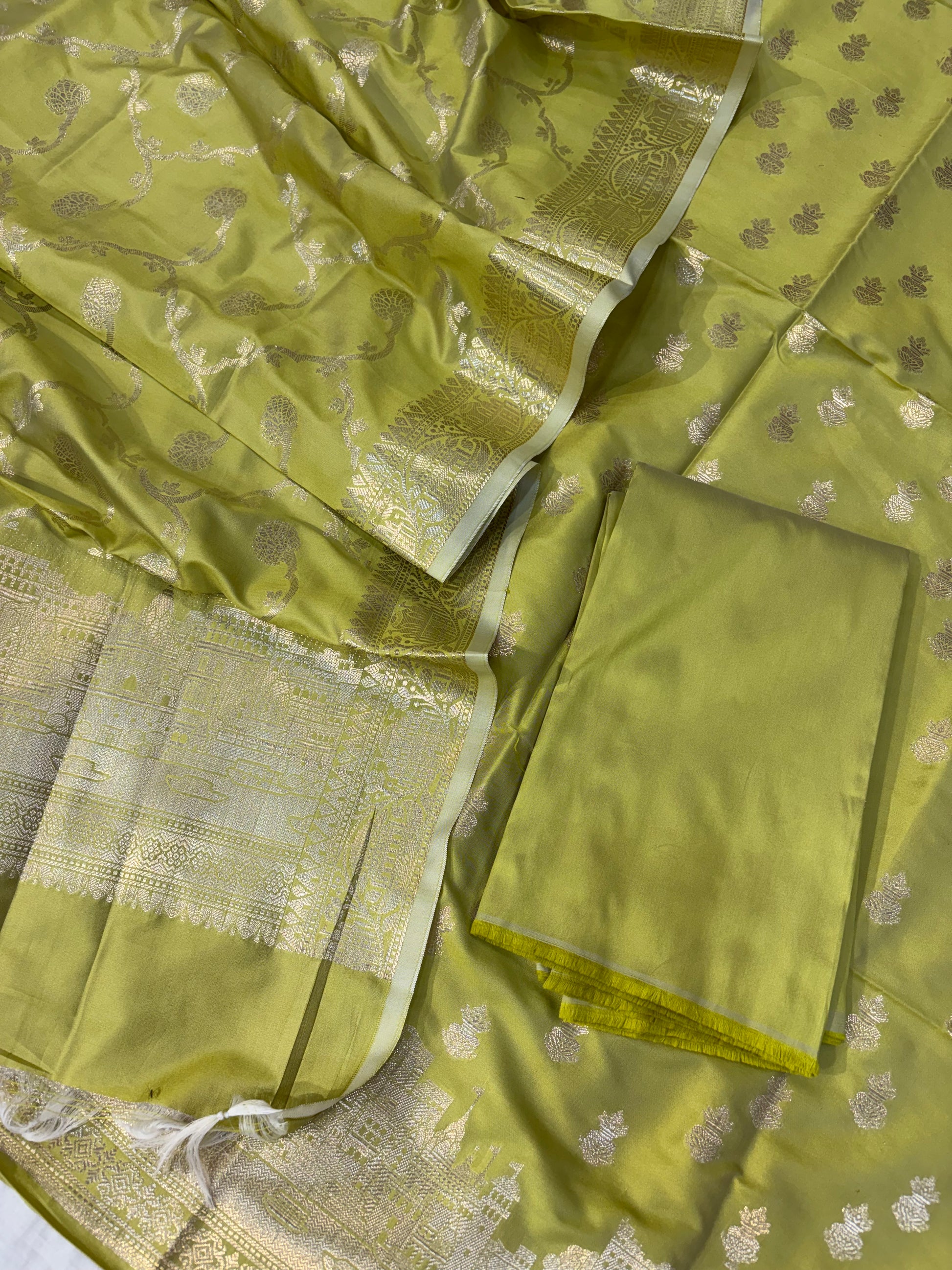 Banarasi soft silk suit in Lime green colour with temple design work
