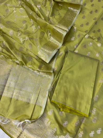 Banarasi soft silk suit in Lime green colour with temple design work