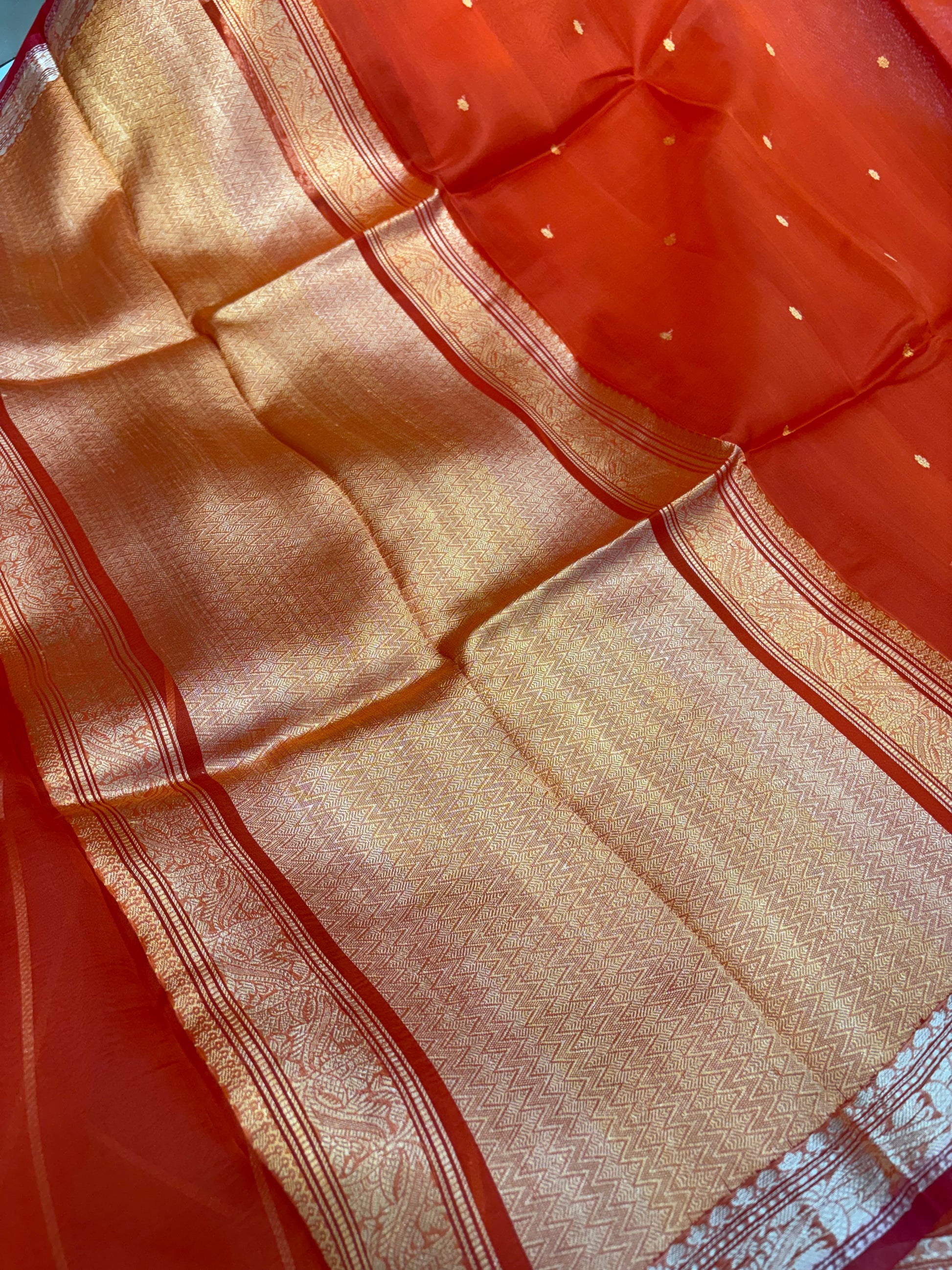 Pure handloom organza silk saree In orange colour with red piping border