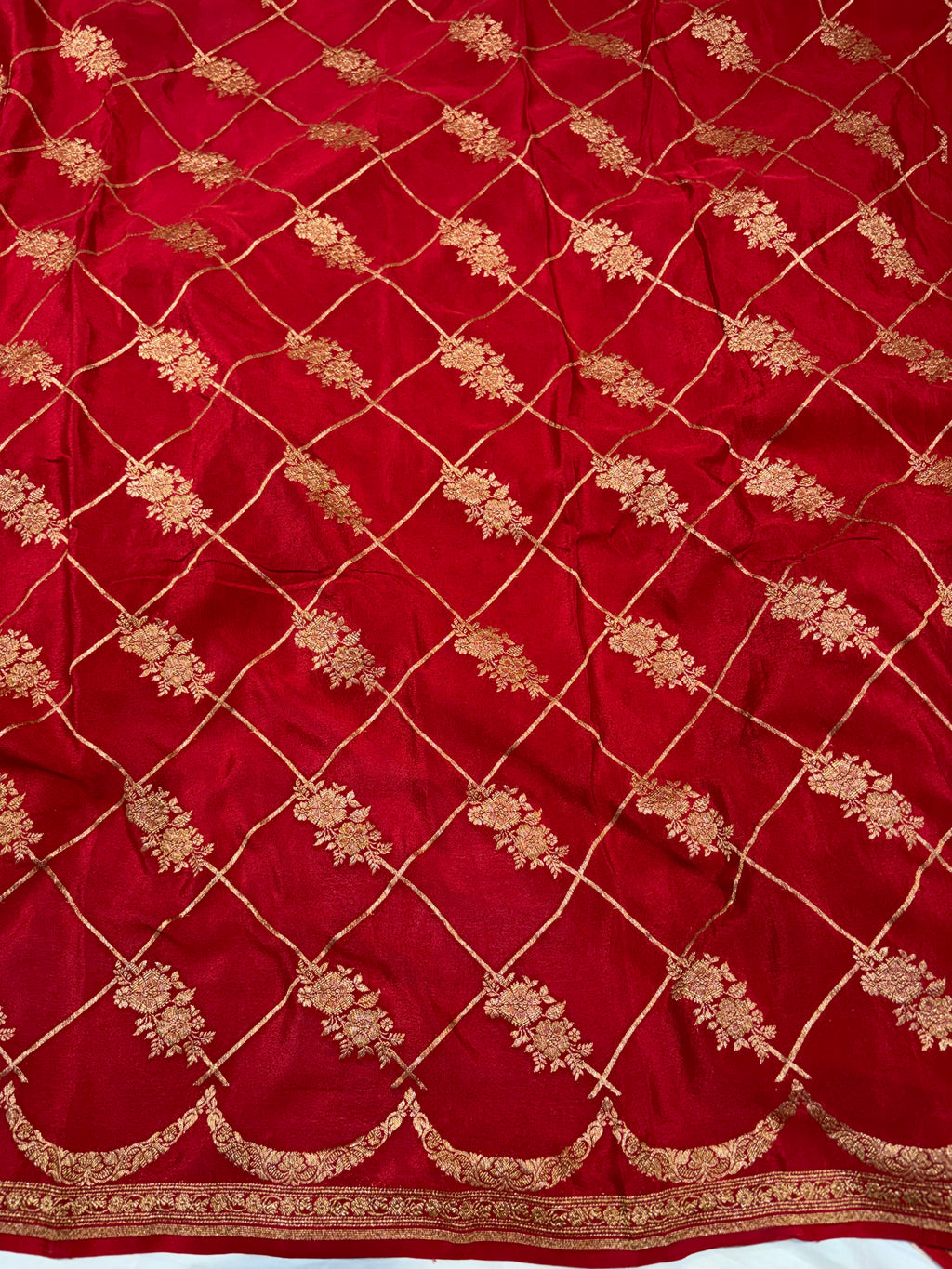 Pure khaddi crepe silk saree in Peach with Red colour