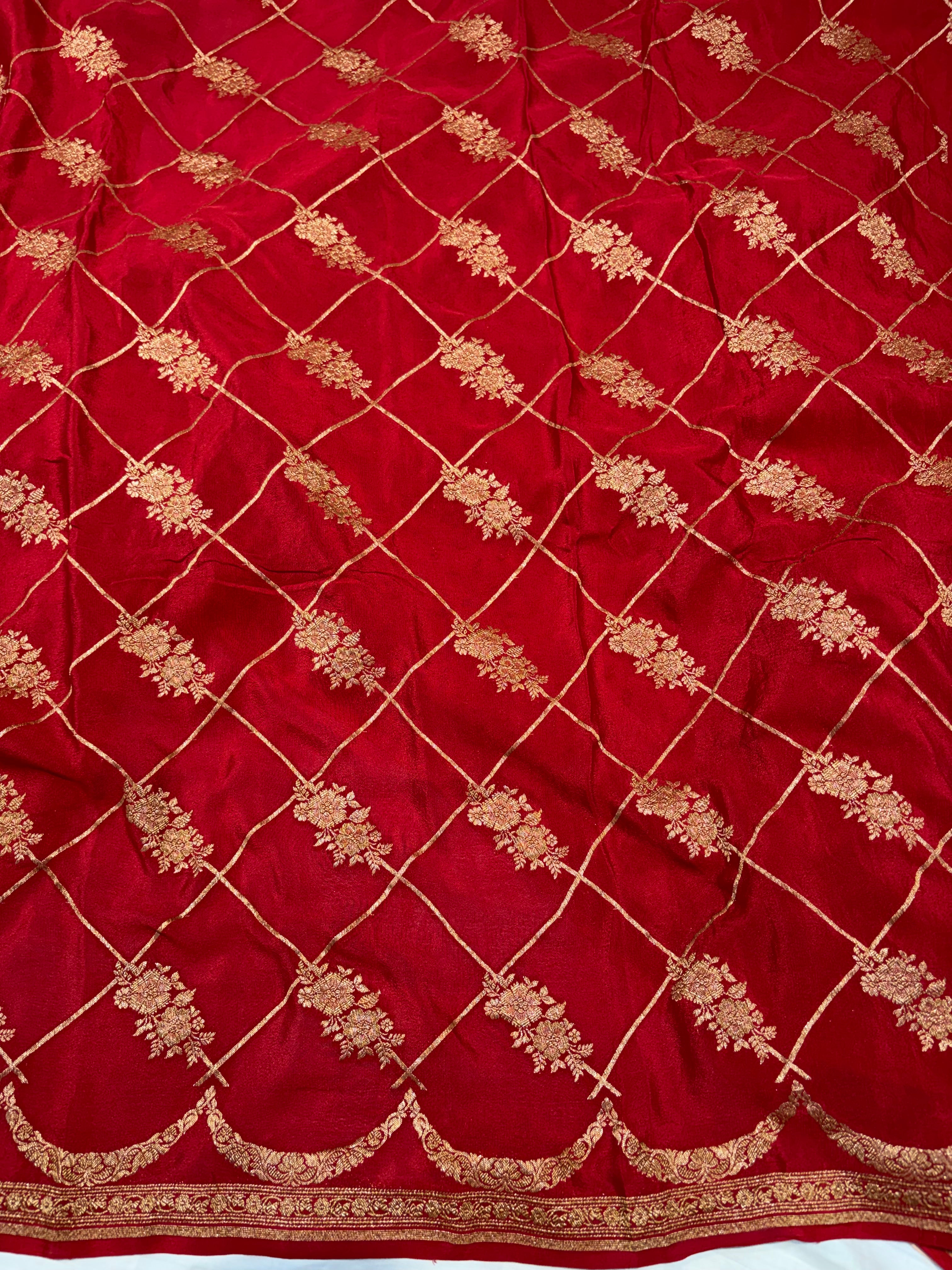Pure khaddi crepe silk saree in Peach with Red colour