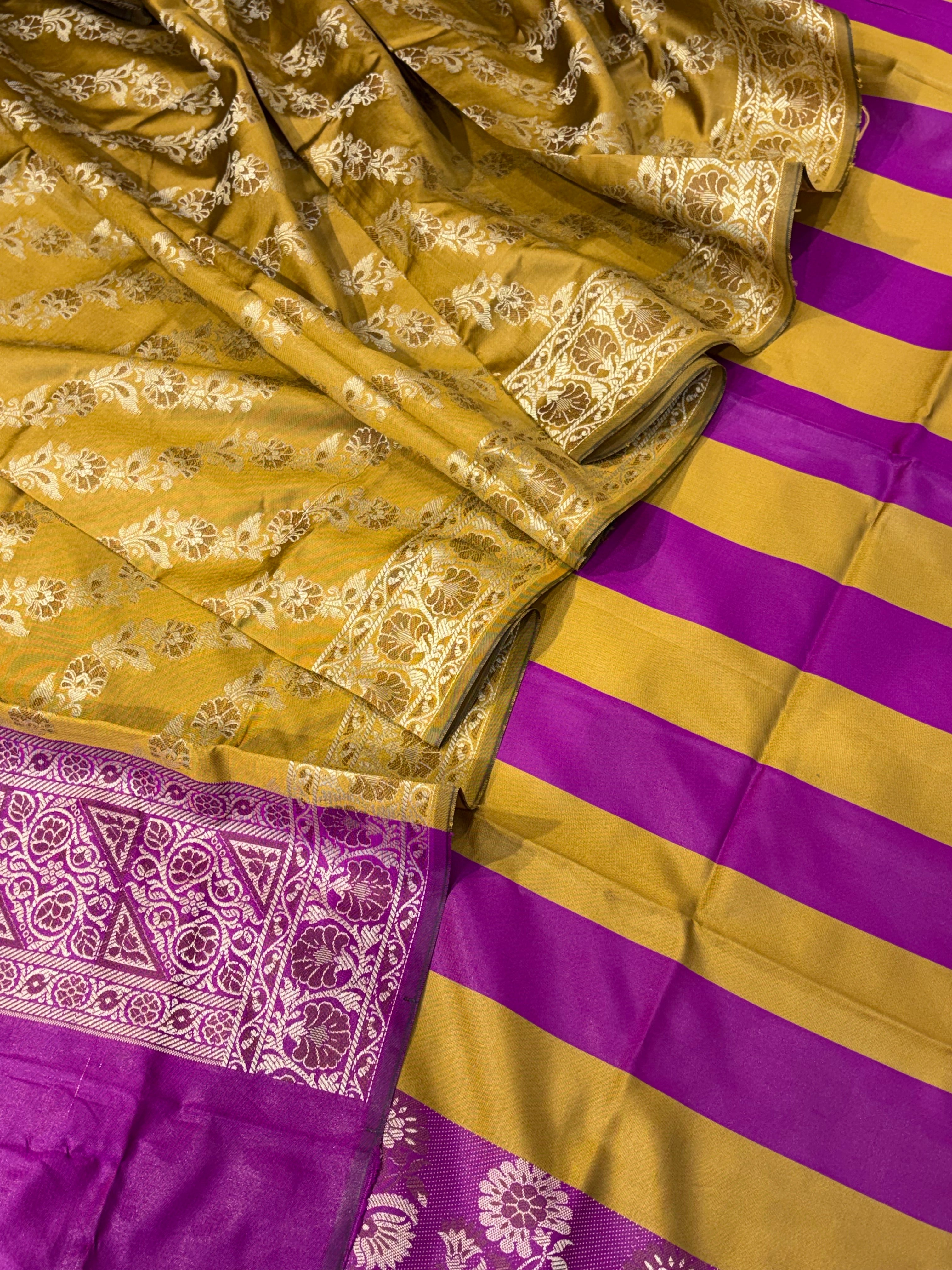 Banarasi soft silk suit in mustard yellow with magenta pink colour combination with tussels