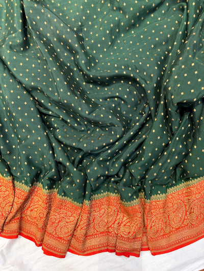 Pure khaddi crepe silk saree in bottle green with burnt orange  colour