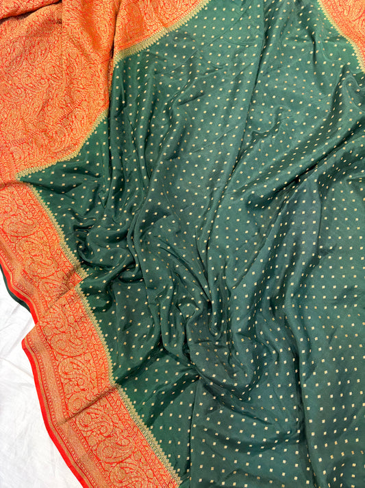 Pure khaddi crepe silk saree in bottle green with burnt orange  colour