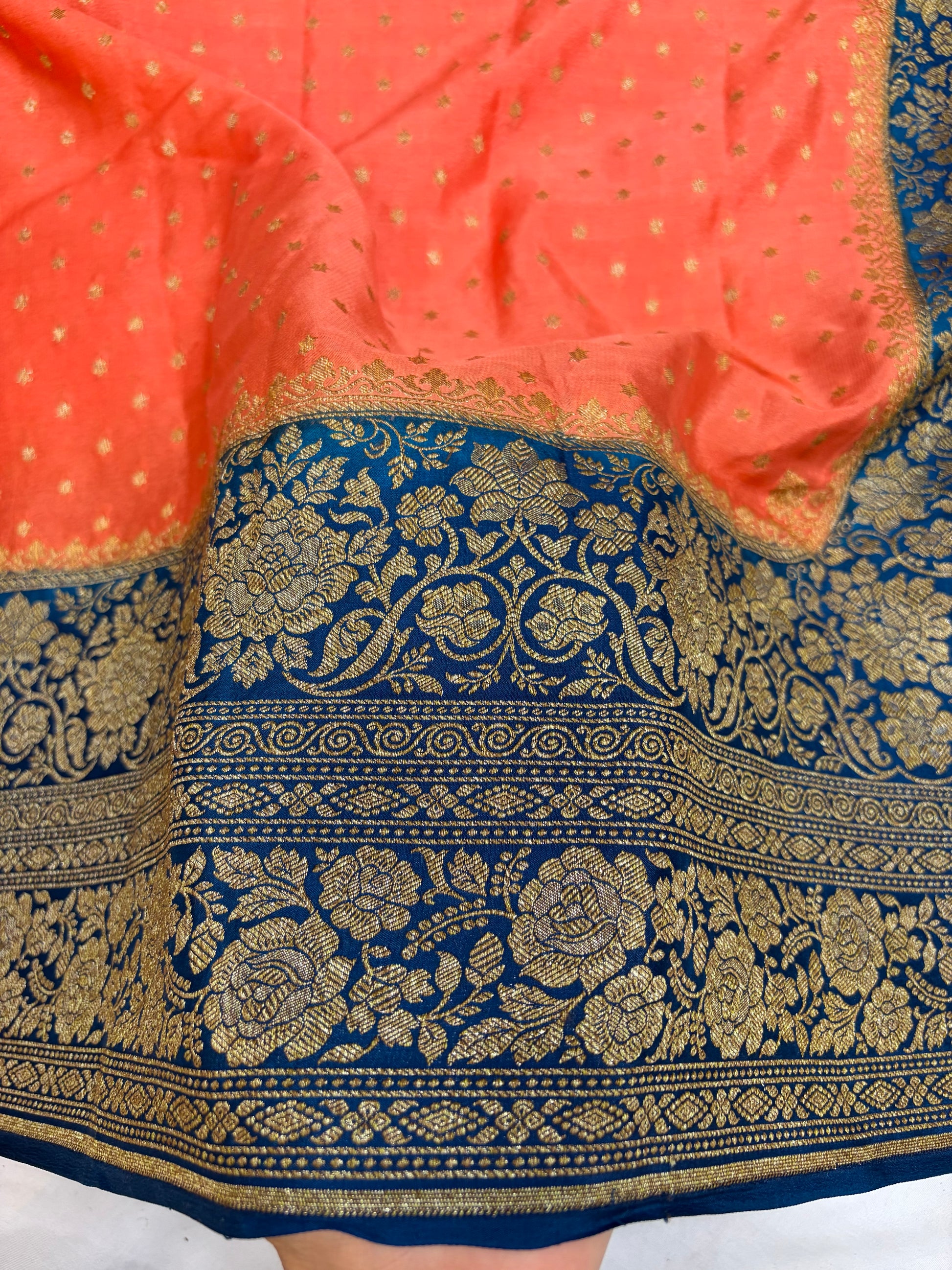 Pure khaddi crepe silk saree in peach & German blue colour