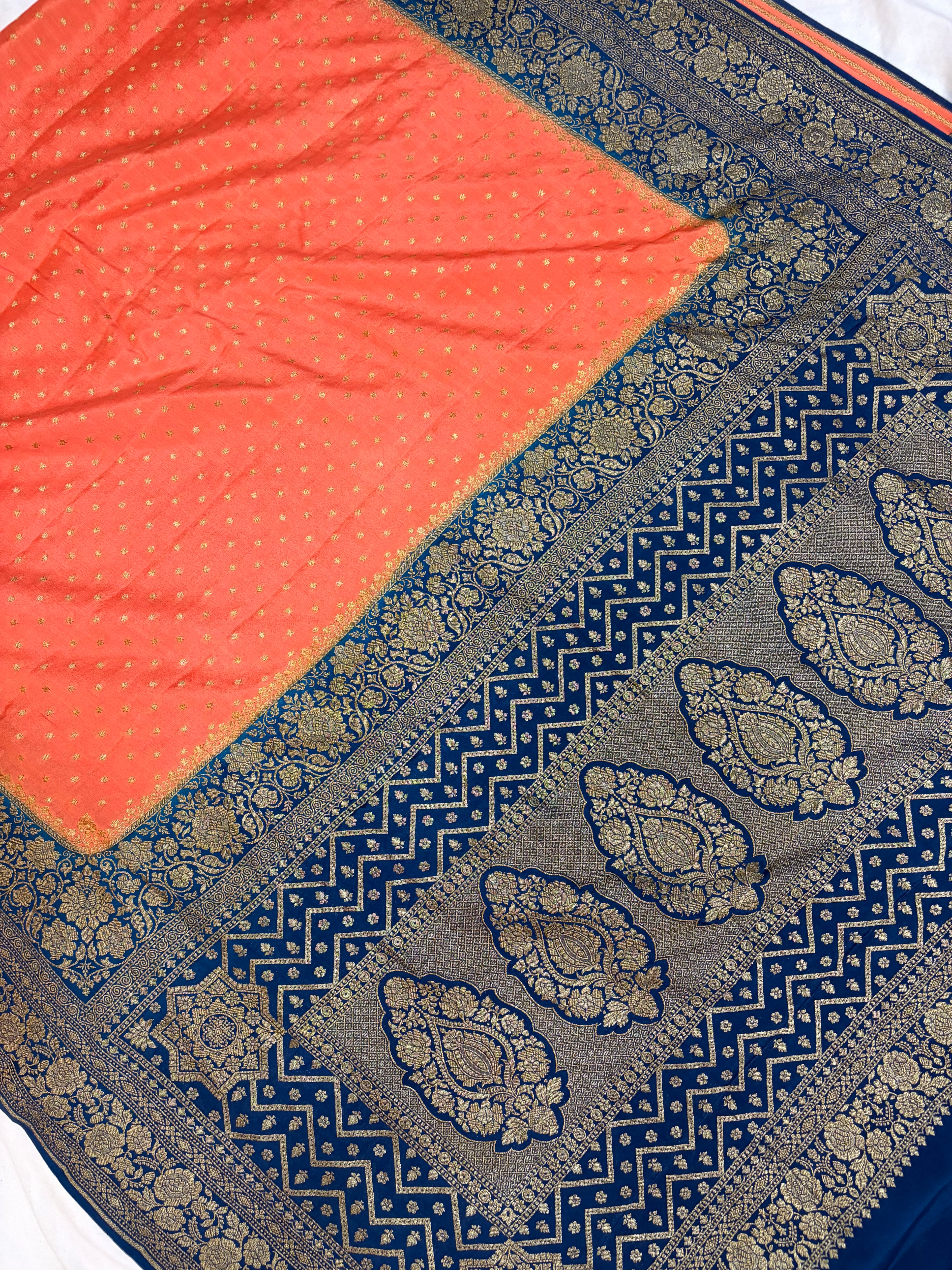 Pure khaddi crepe silk saree in peach & German blue colour