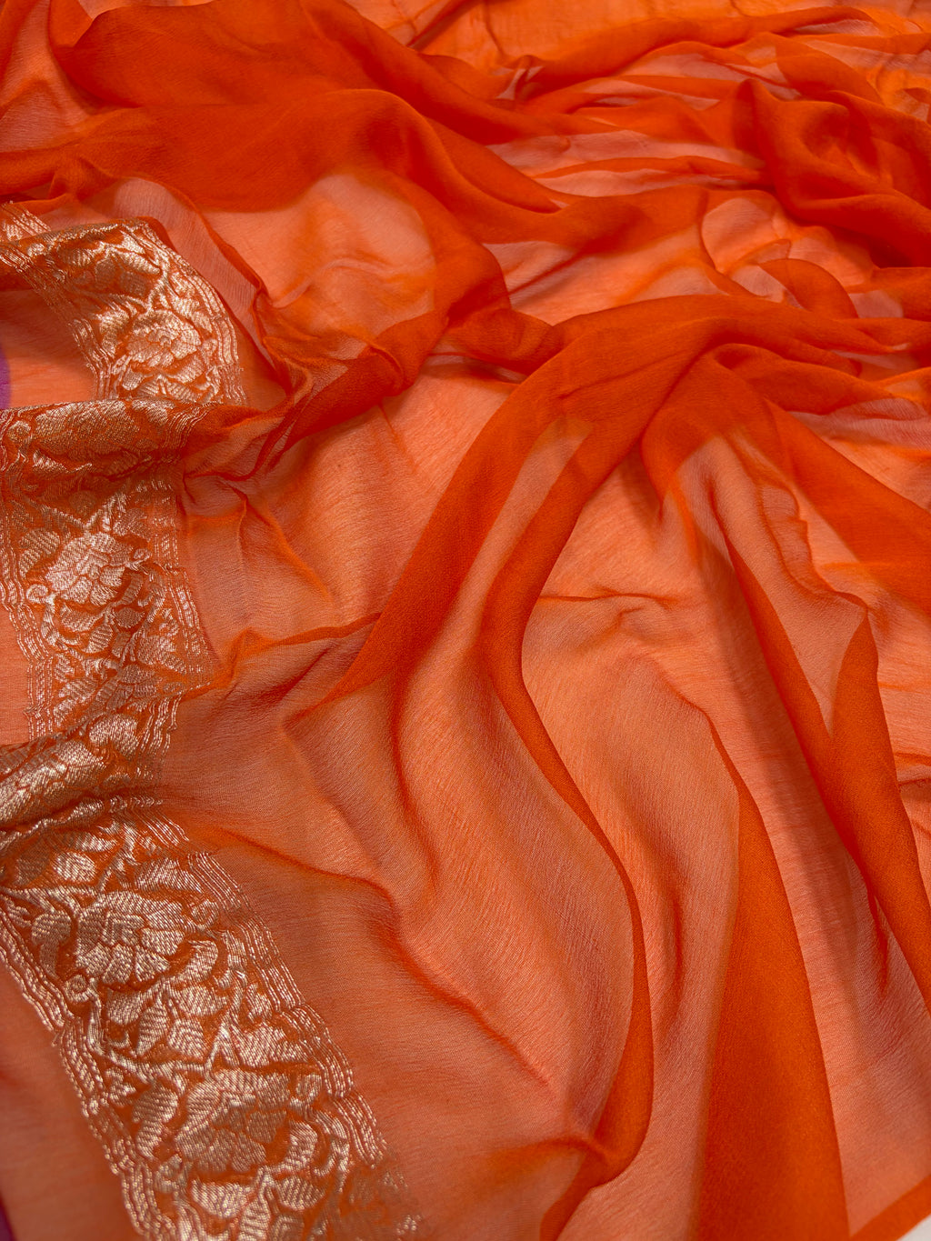 Pure khaddi chiffon saree is rani & orange colour
