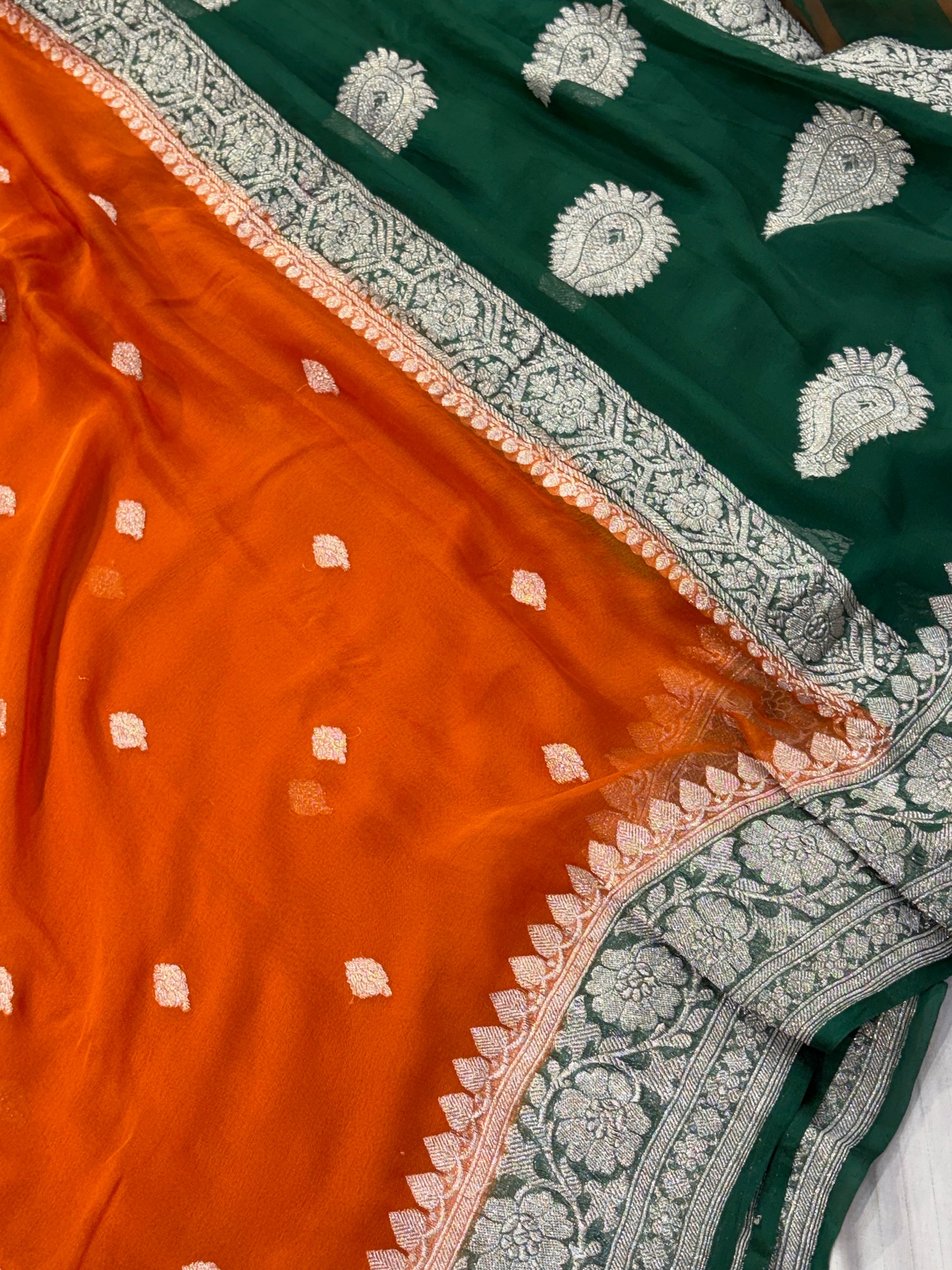 Pure khaddi chiffon saree in rust orange with bottle green colour