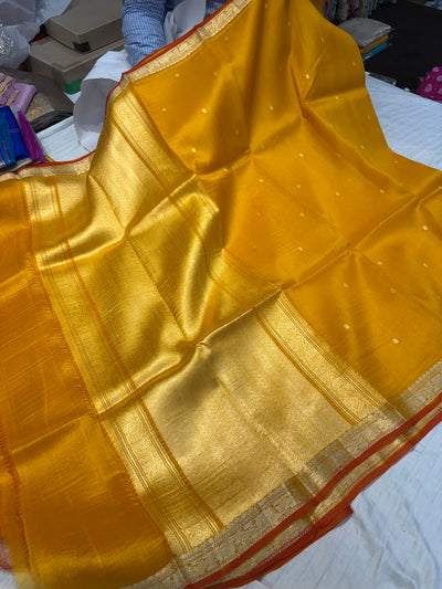 Pure handloom organza silk saree In Mustard yellow colour with rust orange piping border