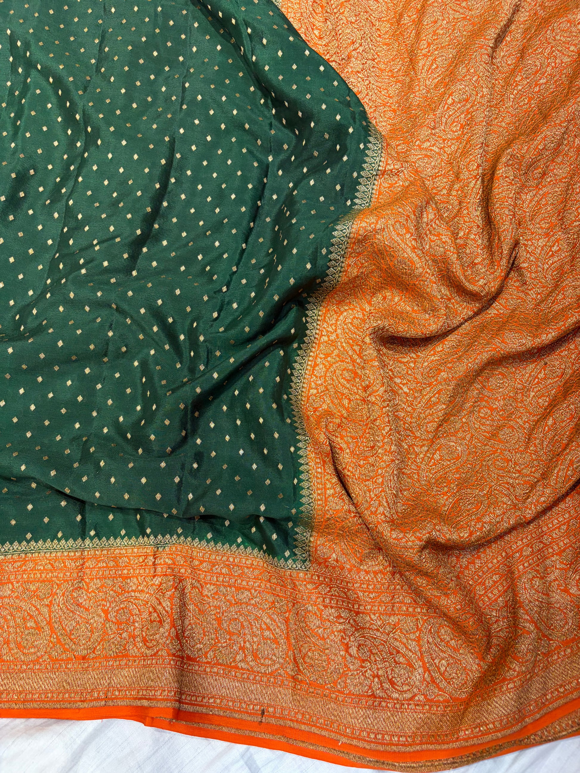 Pure khaddi crepe silk saree in bottle green bright orange colour
