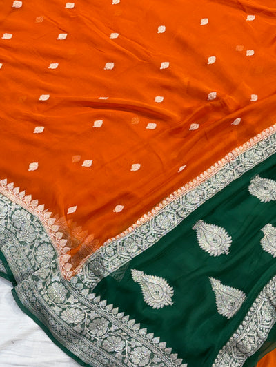 Pure khaddi chiffon saree in rust orange with bottle green colour