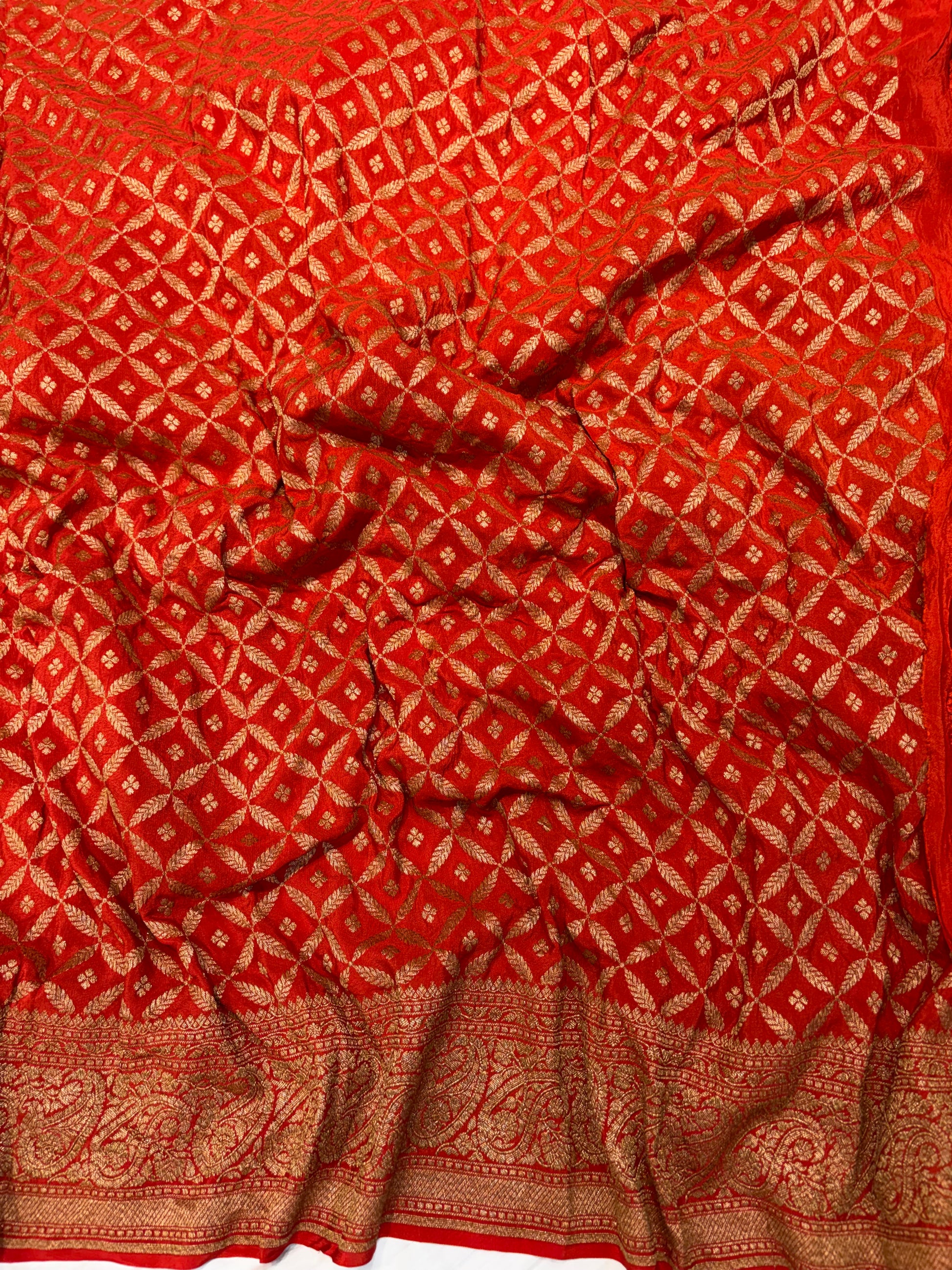 Pure khaddi crepe silk saree in bottle green with burnt orange  colour