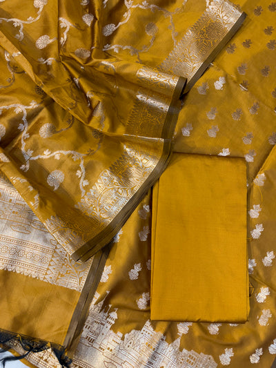 Banarasi soft silk suit in gold colour with temple design work