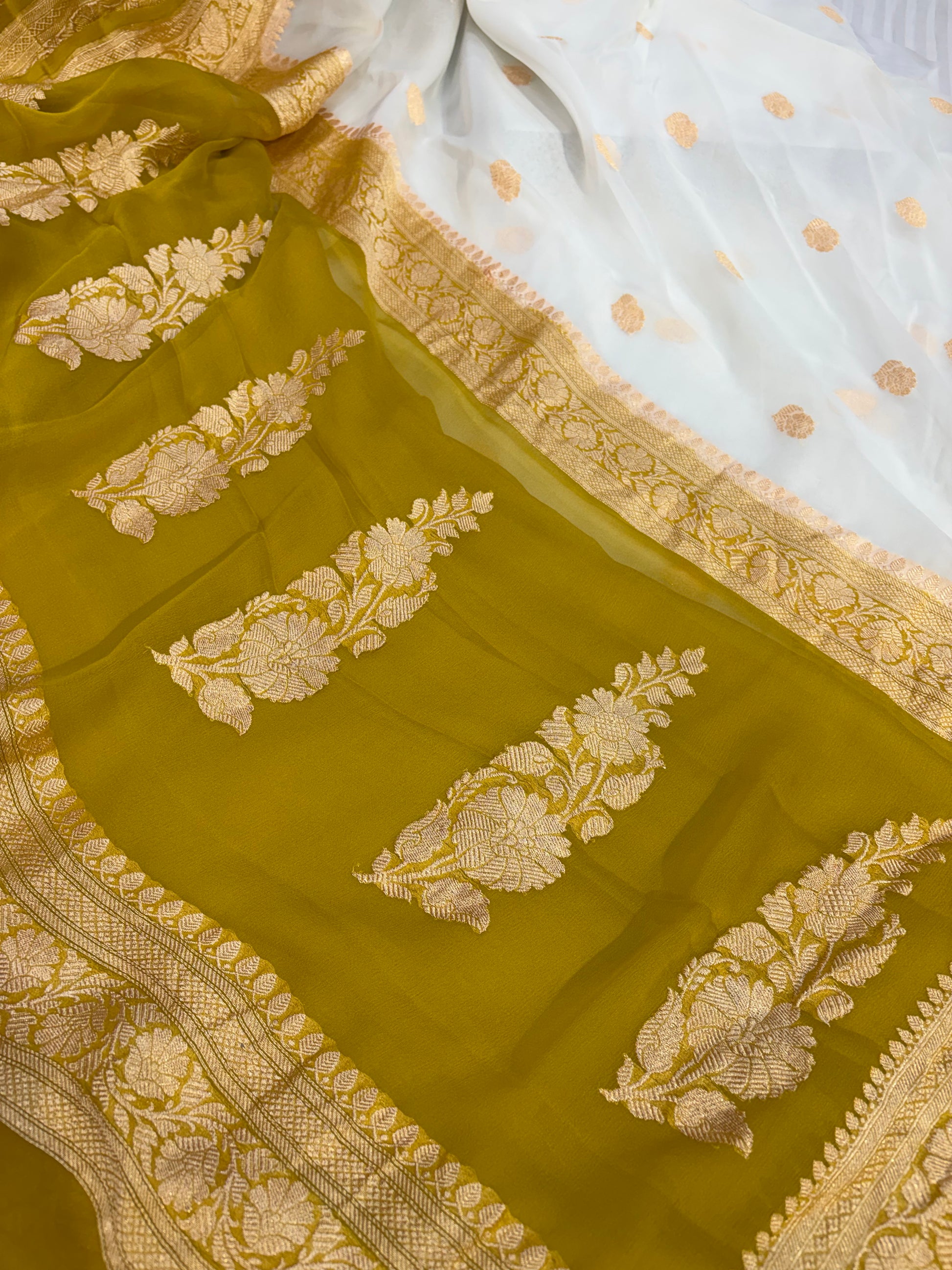 Pure khaddi chiffon saree with gold zari work in off white with olive yellow colour