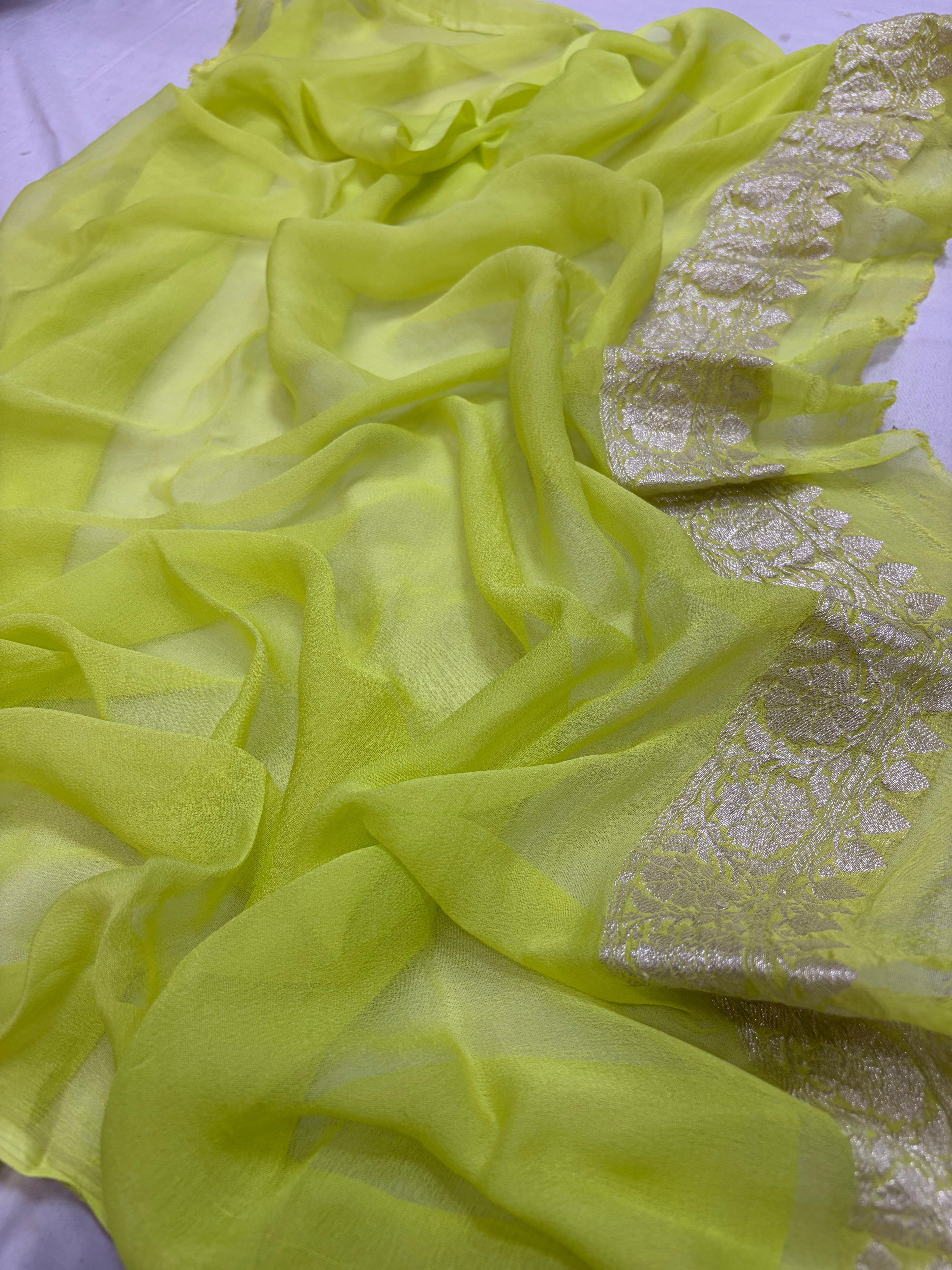Pure khaddi chiffon saree in neon green colour with Rani pink piping border