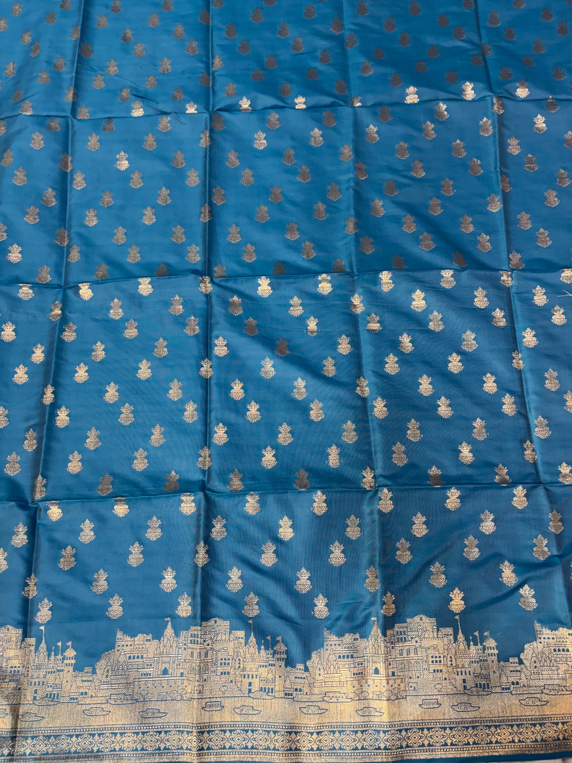 Banarasi soft silk suit in turquoise blue colour with temple design work