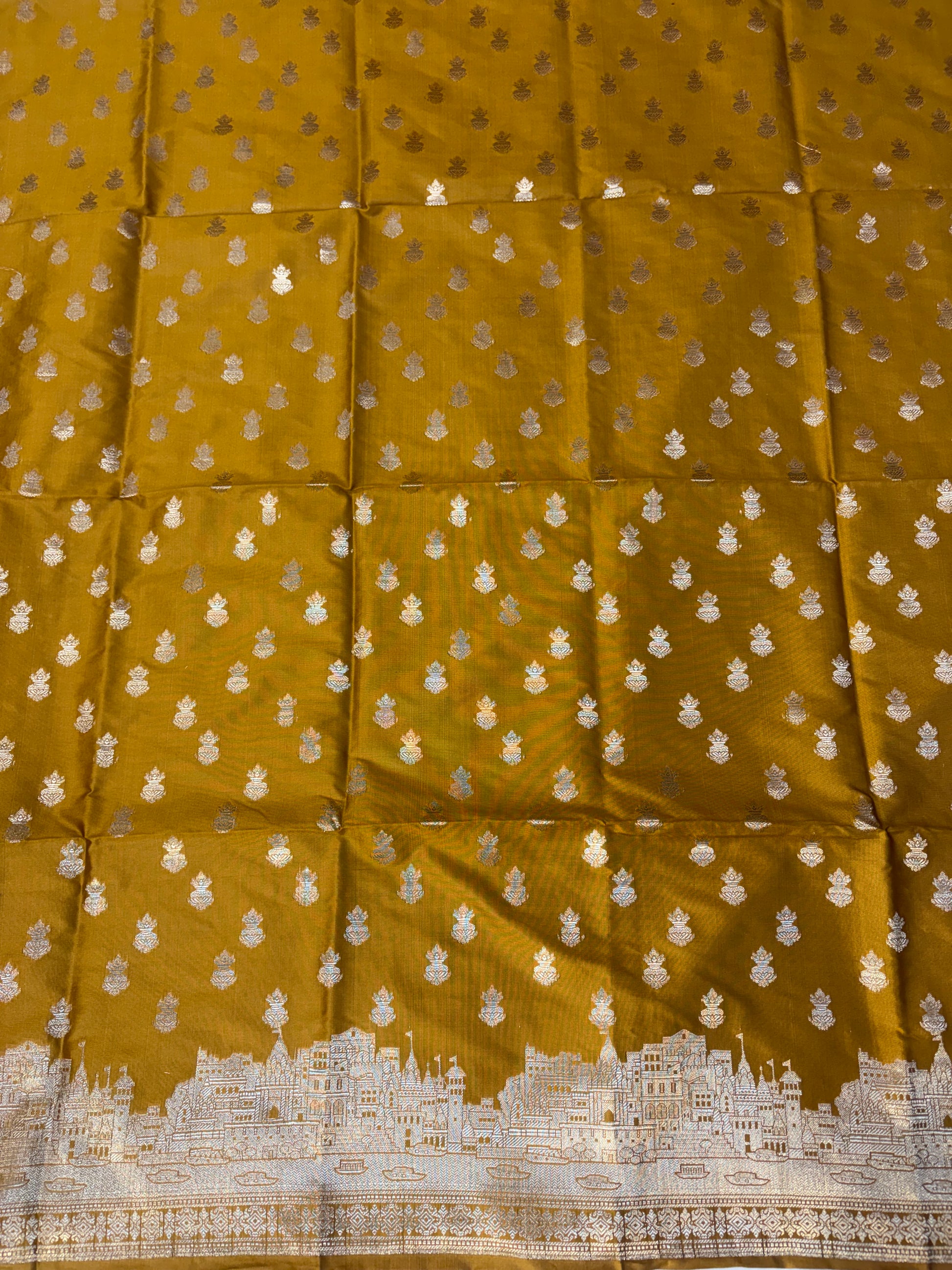 Banarasi soft silk suit in gold colour with temple design work
