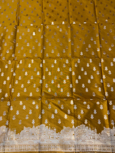 Banarasi soft silk suit in gold colour with temple design work