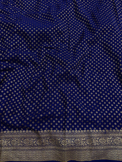 Pure khaddi crepe silk saree with all over jaal work in Rani with navy blue colour combination