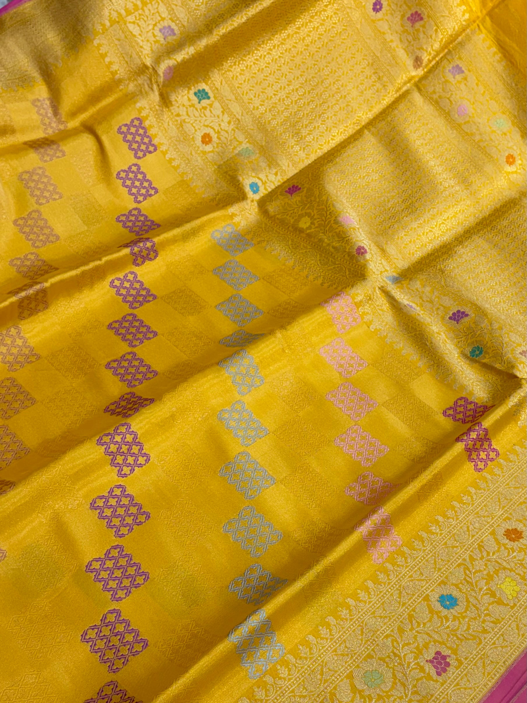 Pure katan tissue silk saree in gold colour with multiple meenakari work