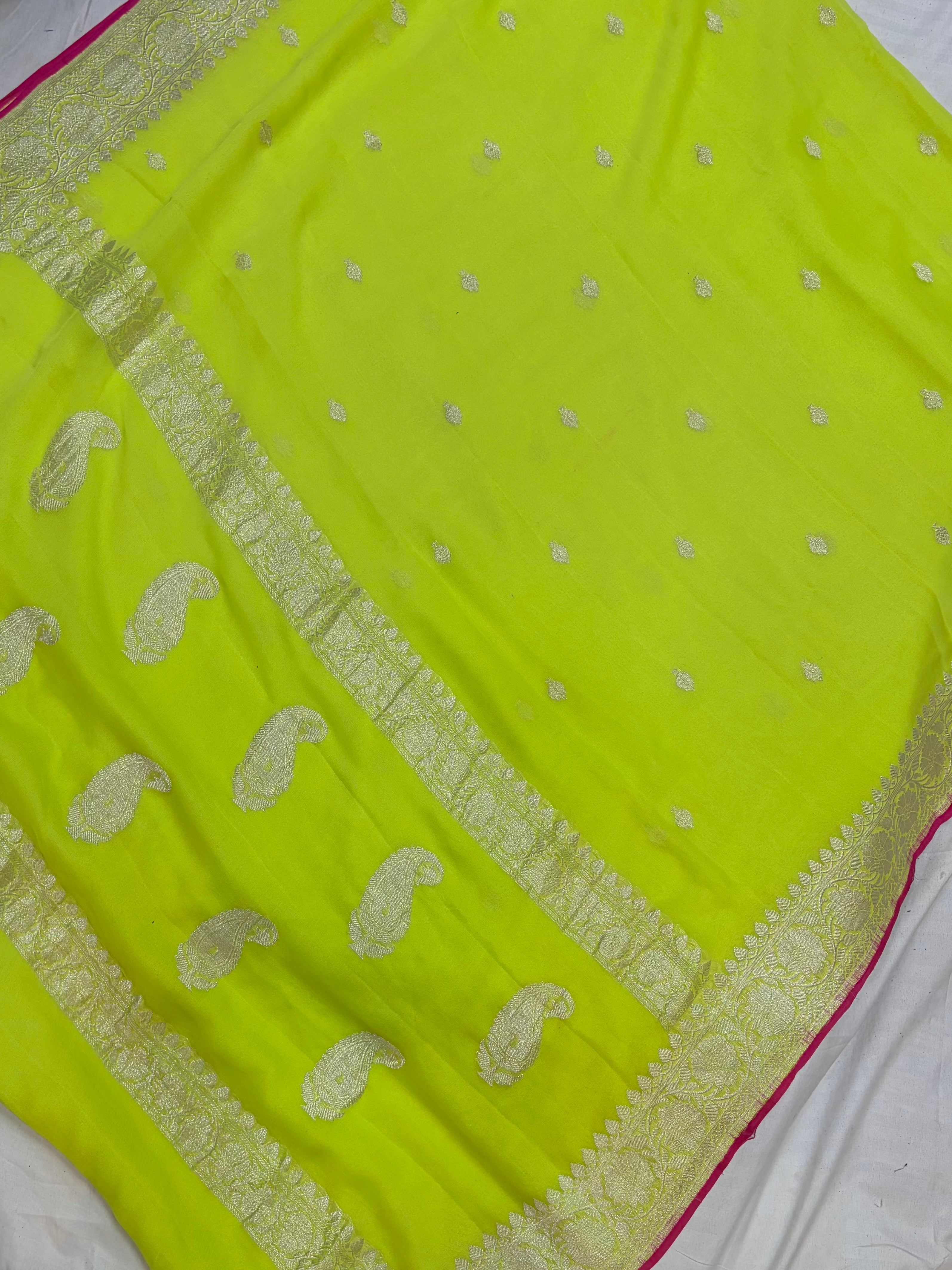 Pure khaddi chiffon saree in neon green colour with Rani pink piping border