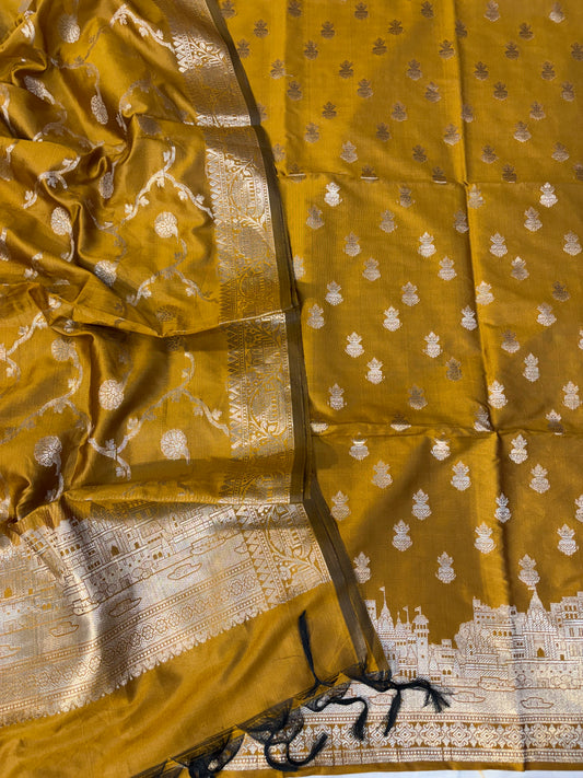 Banarasi soft silk suit in gold colour with temple design work