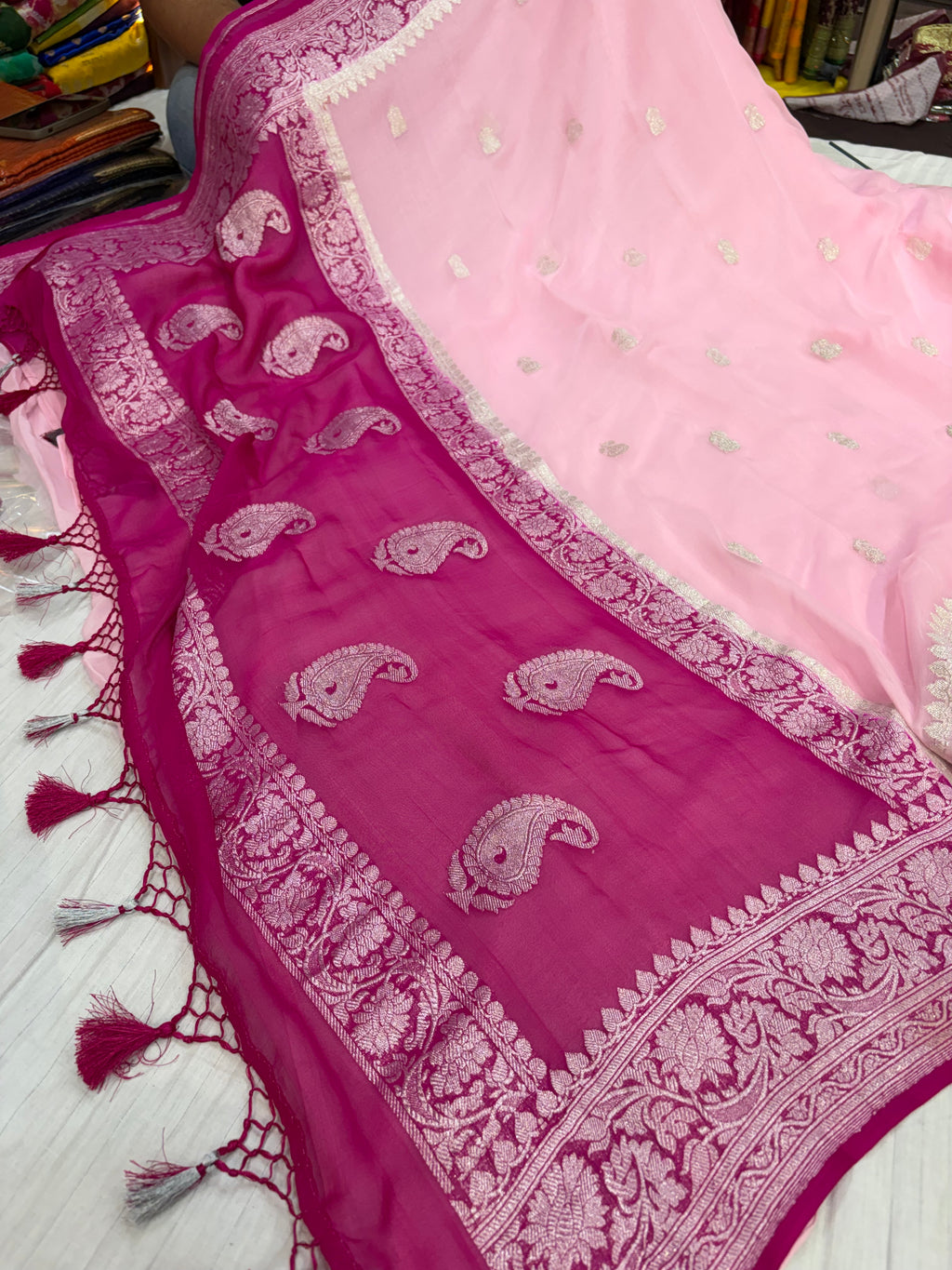 Pure khaddi chiffon saree in baby pink with Rani colour with tussles