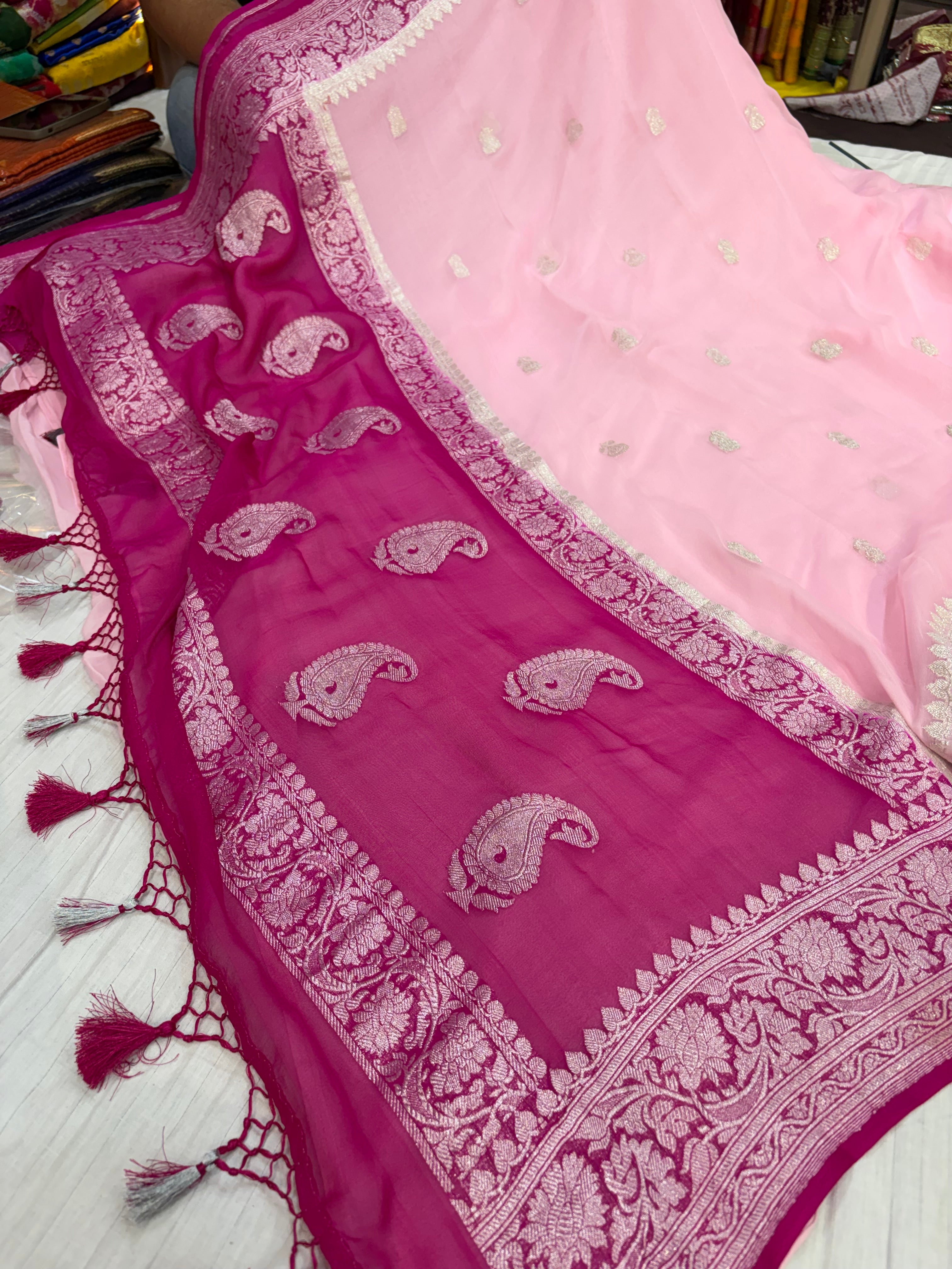 Pure khaddi chiffon saree in baby pink with Rani colour with tussles