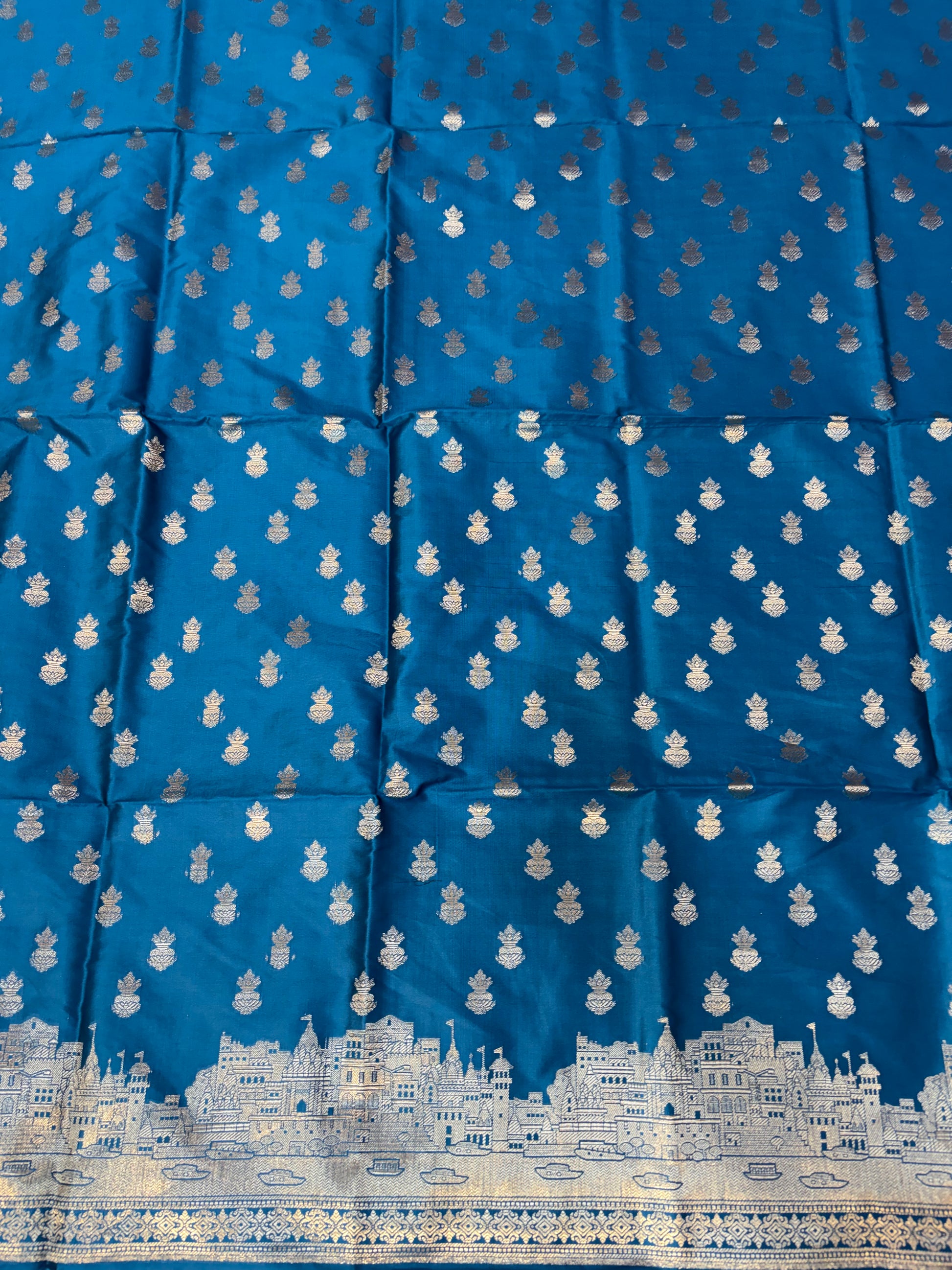 Banarasi soft silk suit in Teal blue colour with temple design work