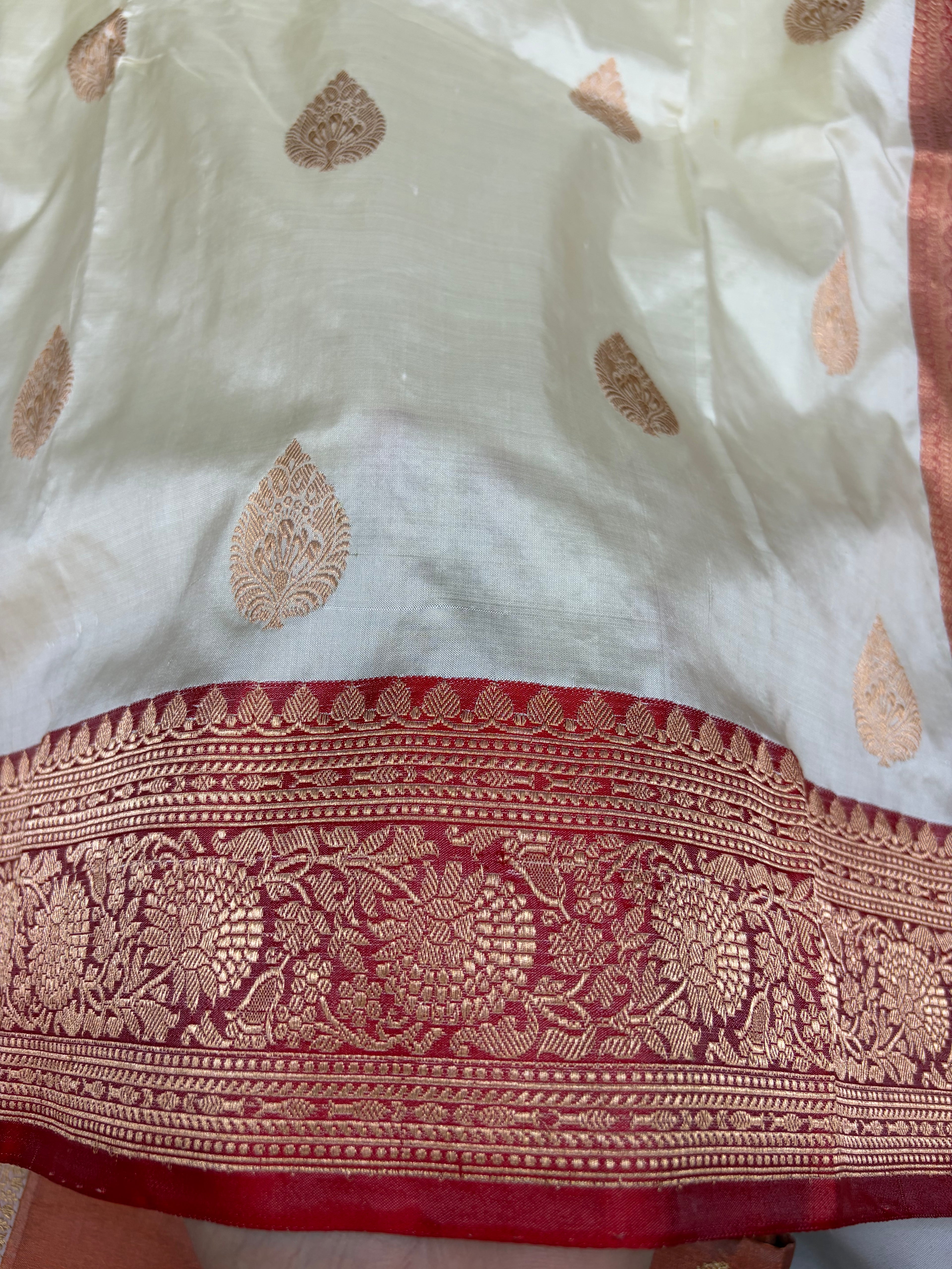 Pure handwoven katan silk saree in off white with red colour
