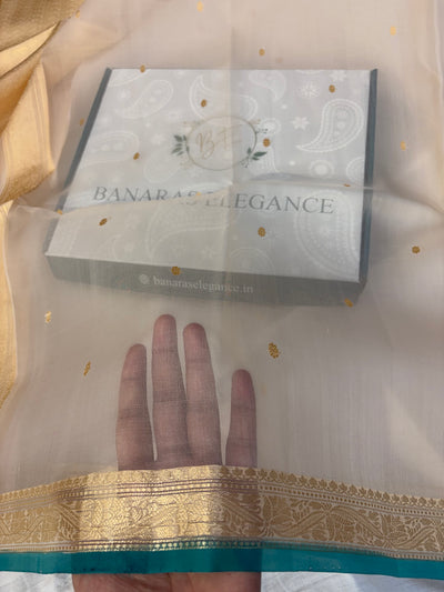 Pure handloom organza silk saree In off white colour with Rama green piping border