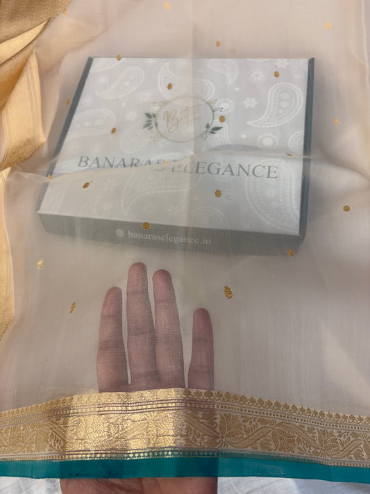 Pure handloom organza silk saree In off white colour with Rama green piping border