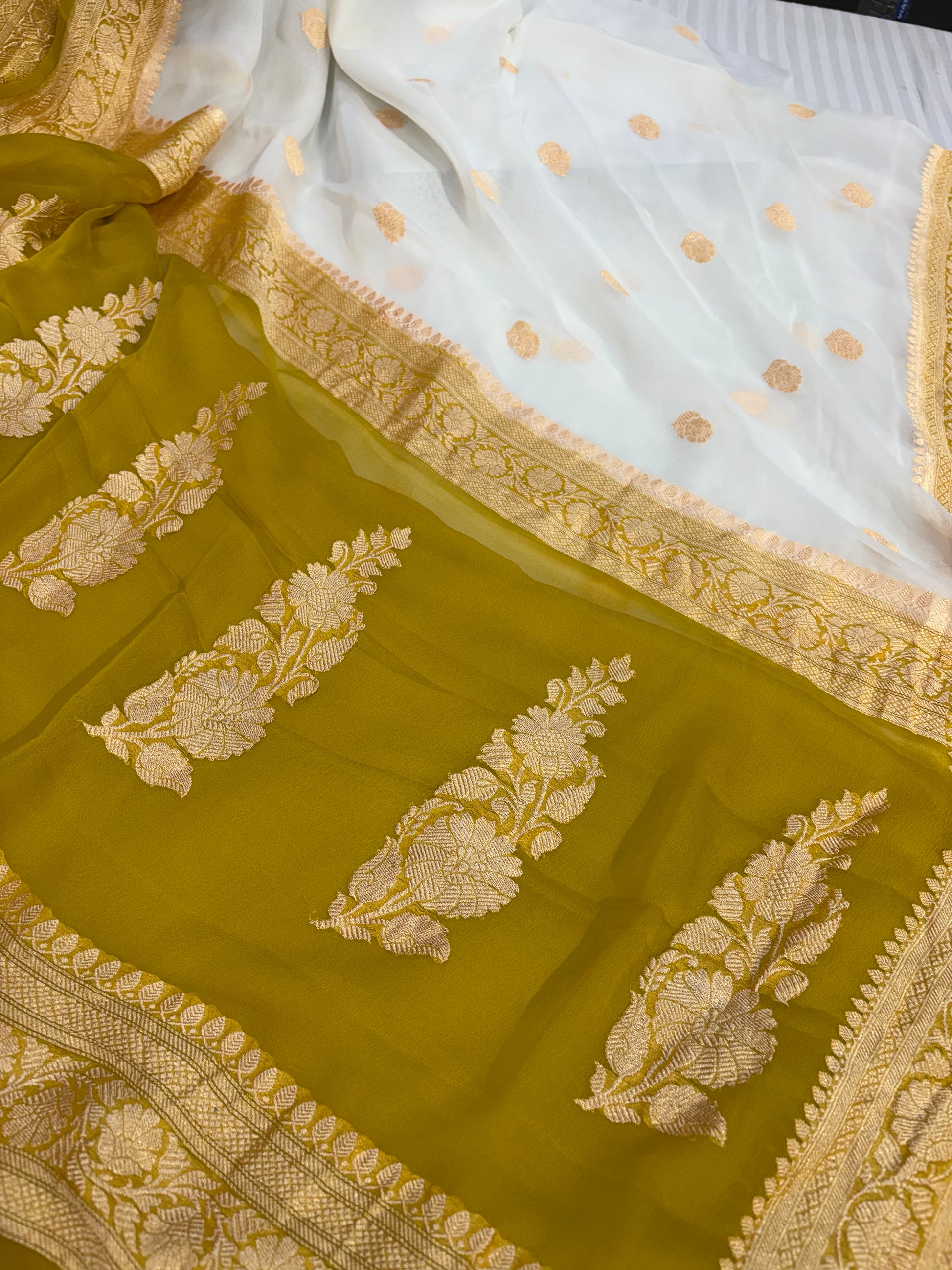 Pure khaddi chiffon saree with gold zari work in off white with olive yellow colour