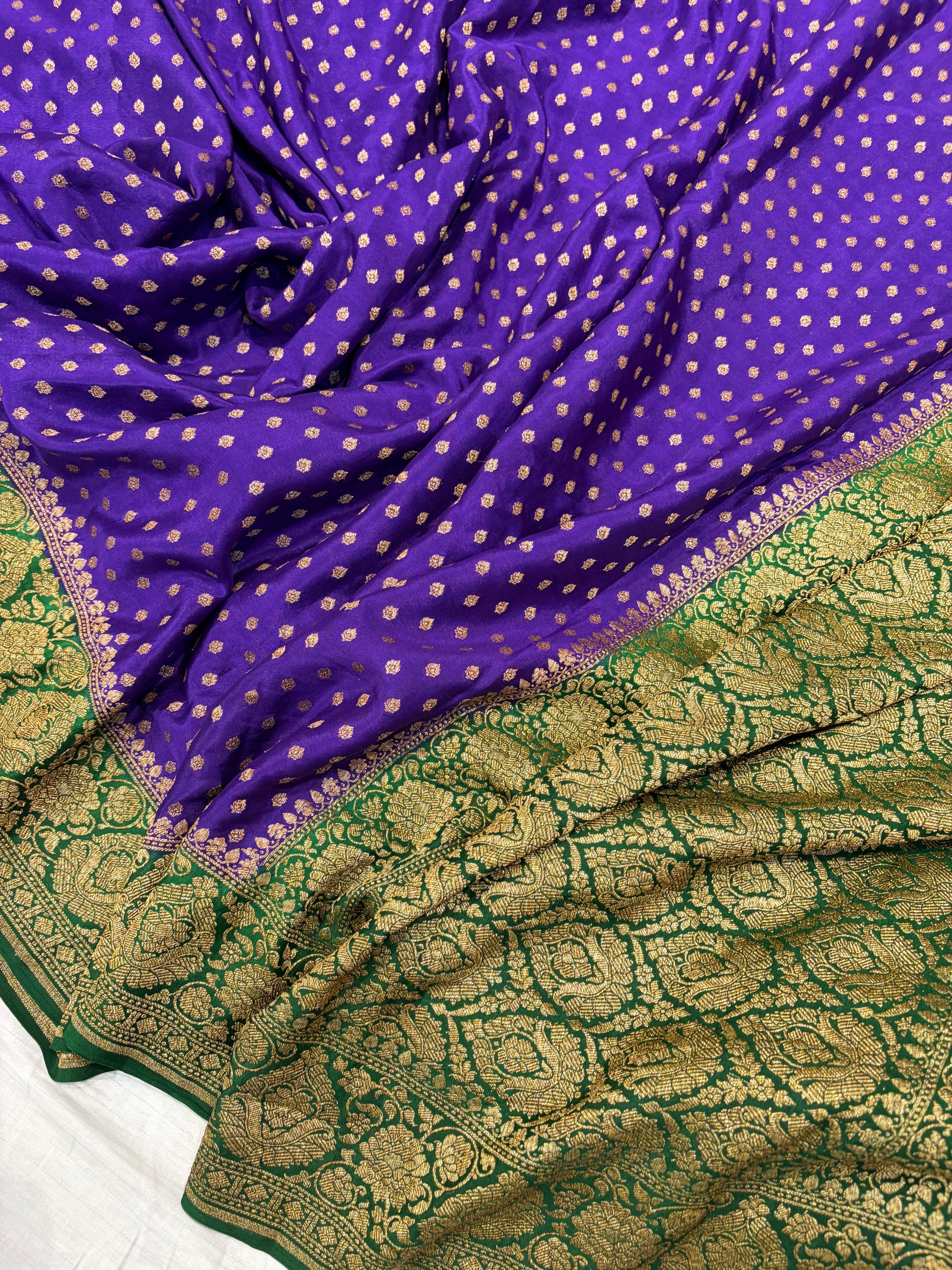 Pure khaddi crepe silk saree in purple with bottle green colour