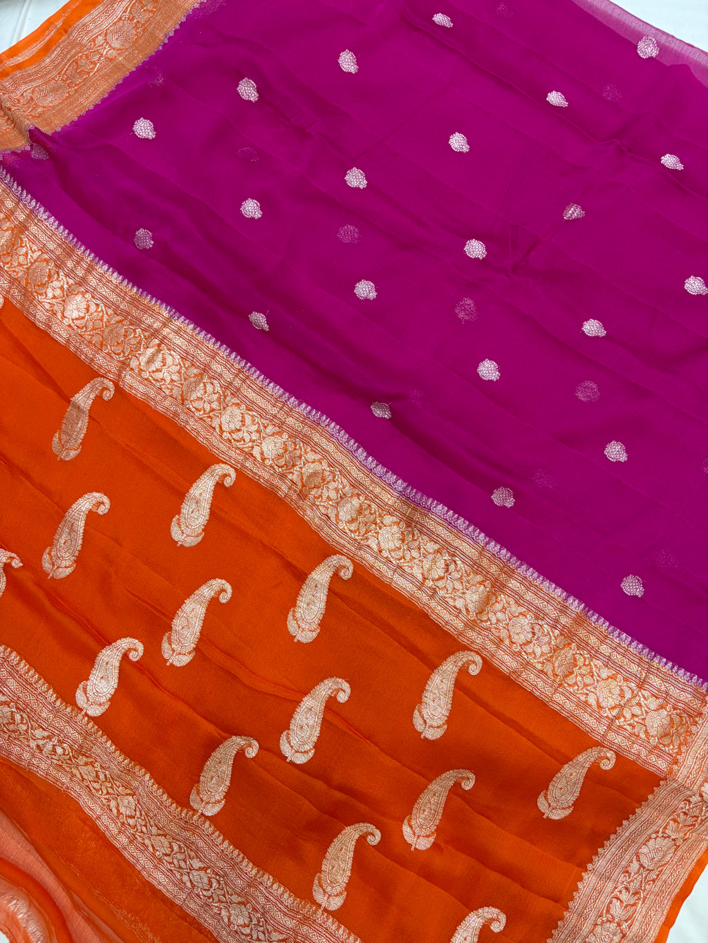 Pure khaddi chiffon saree is rani & orange colour