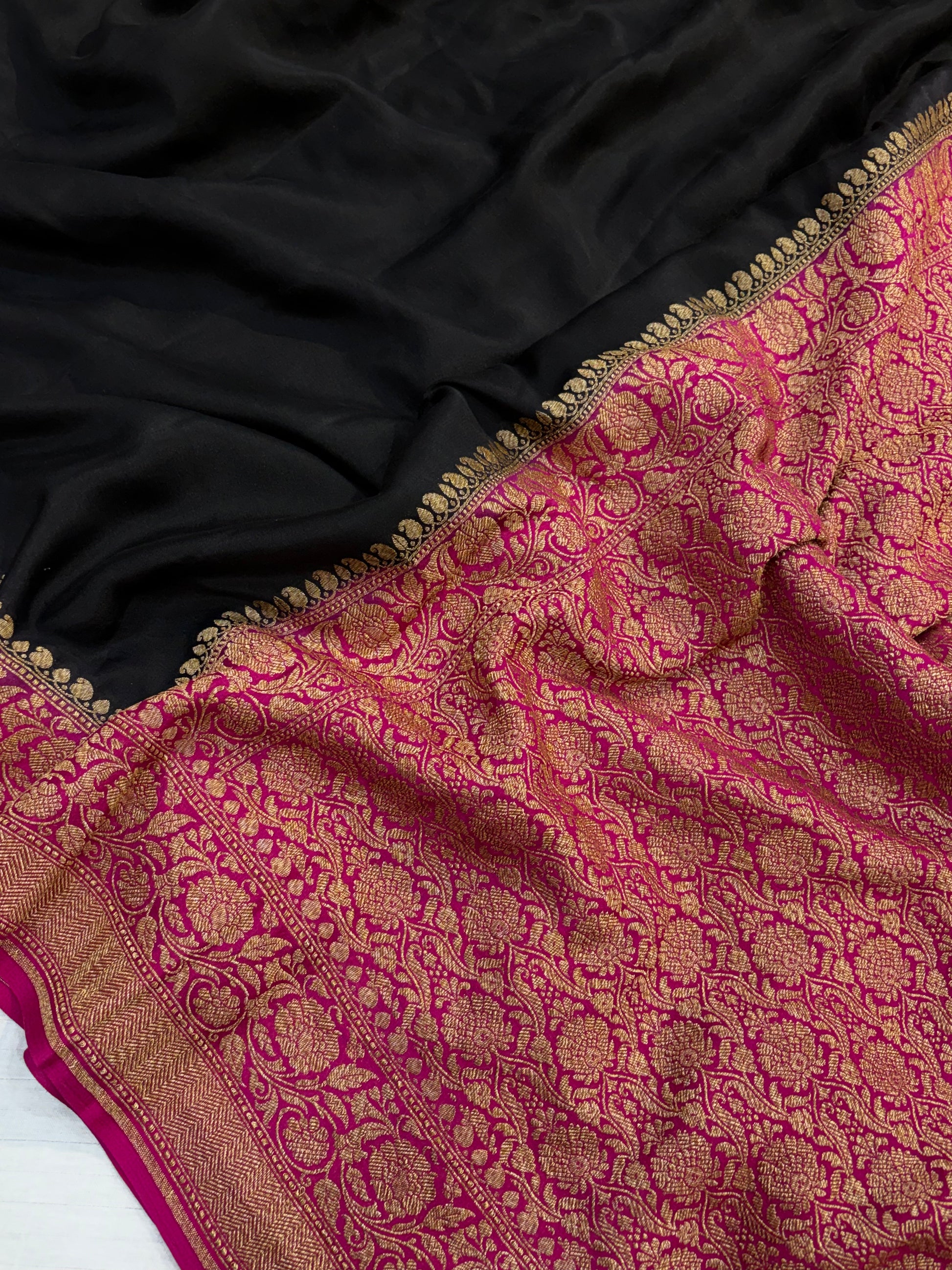 Pure khaddi crepe silk saree in black and Rani combination with pure antic zari work