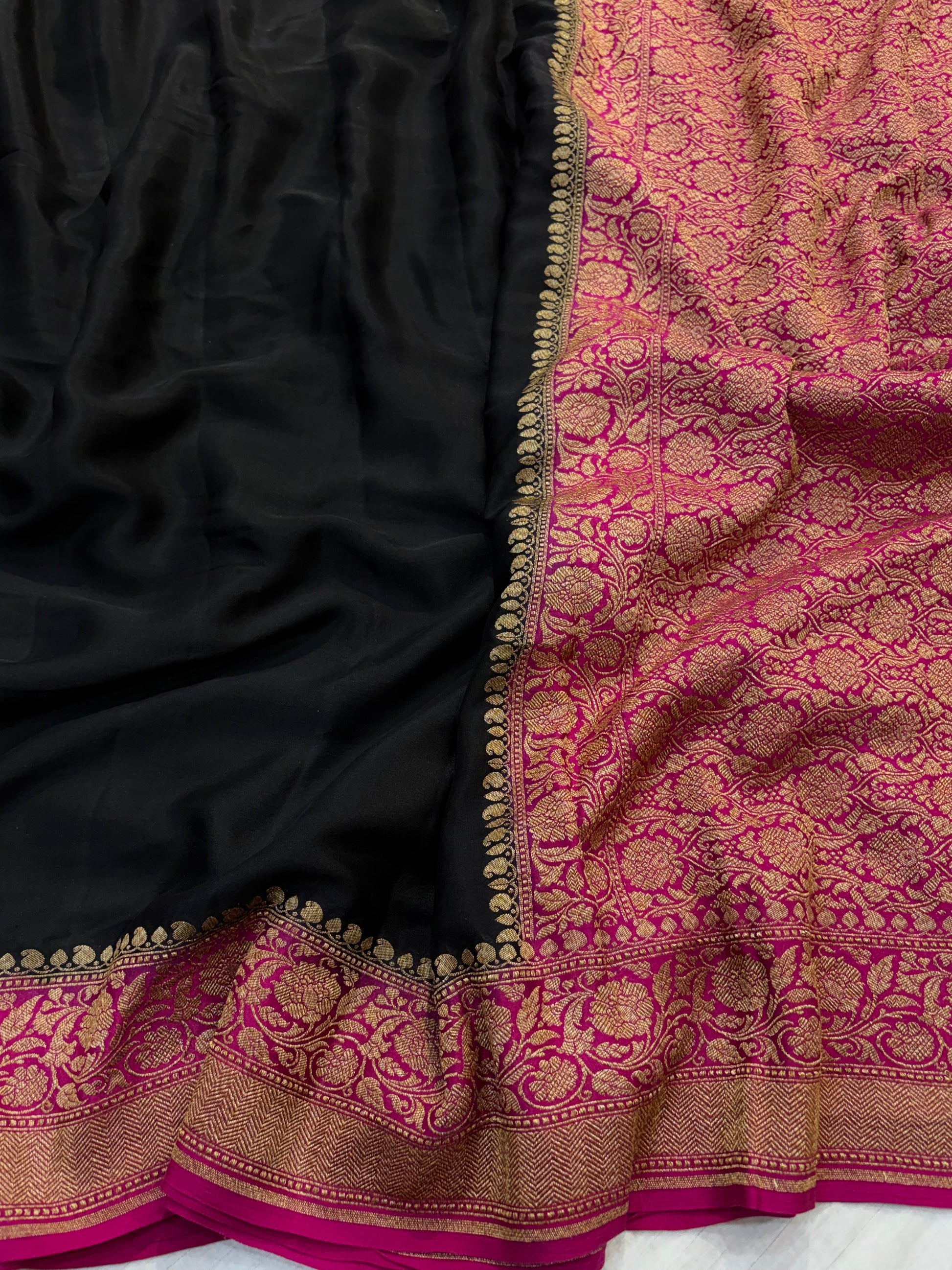 Pure khaddi crepe silk saree in black and Rani combination with pure antic zari work