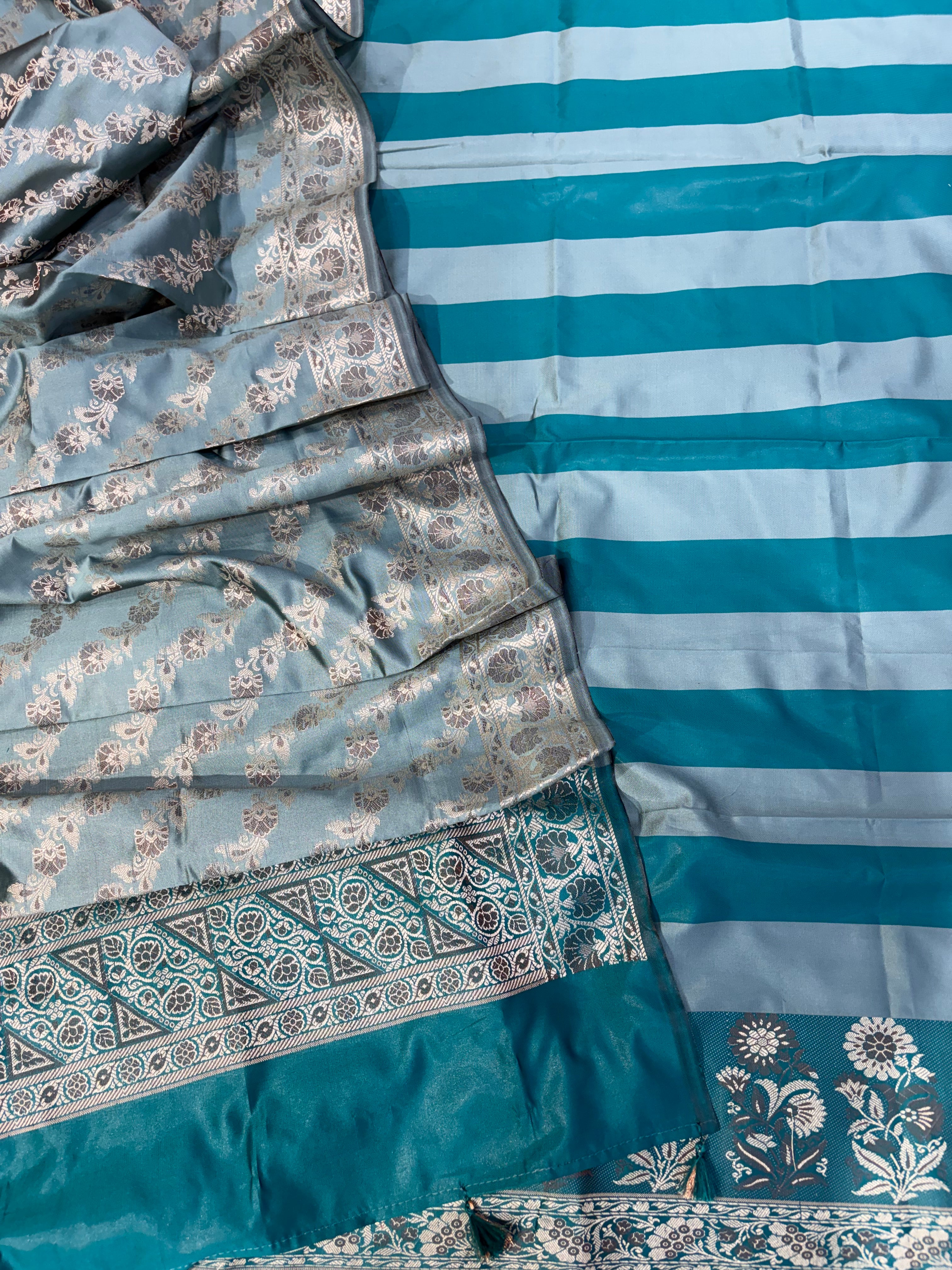 Banarasi soft silk suit in teal blue  with ice blue colour combination with tussels