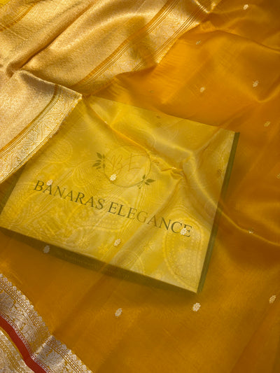 Pure handloom organza silk saree In Mustard yellow colour with rust orange piping border