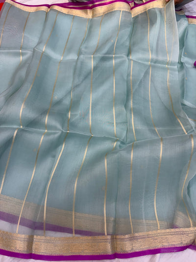 Pure handloom organza silk saree In powder blue colour with Magenta piping border