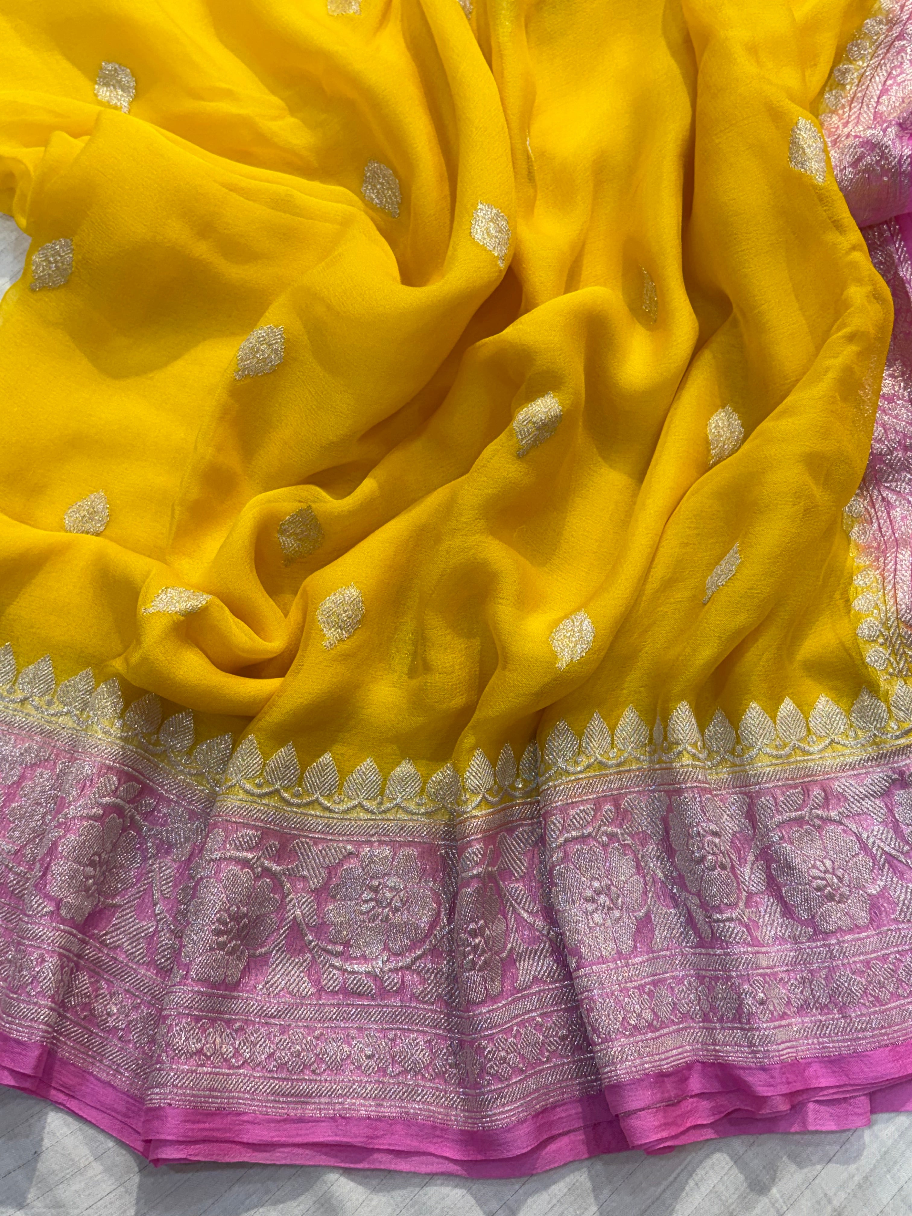 Pure khaddi chiffon saree in yellow with pink colour combination