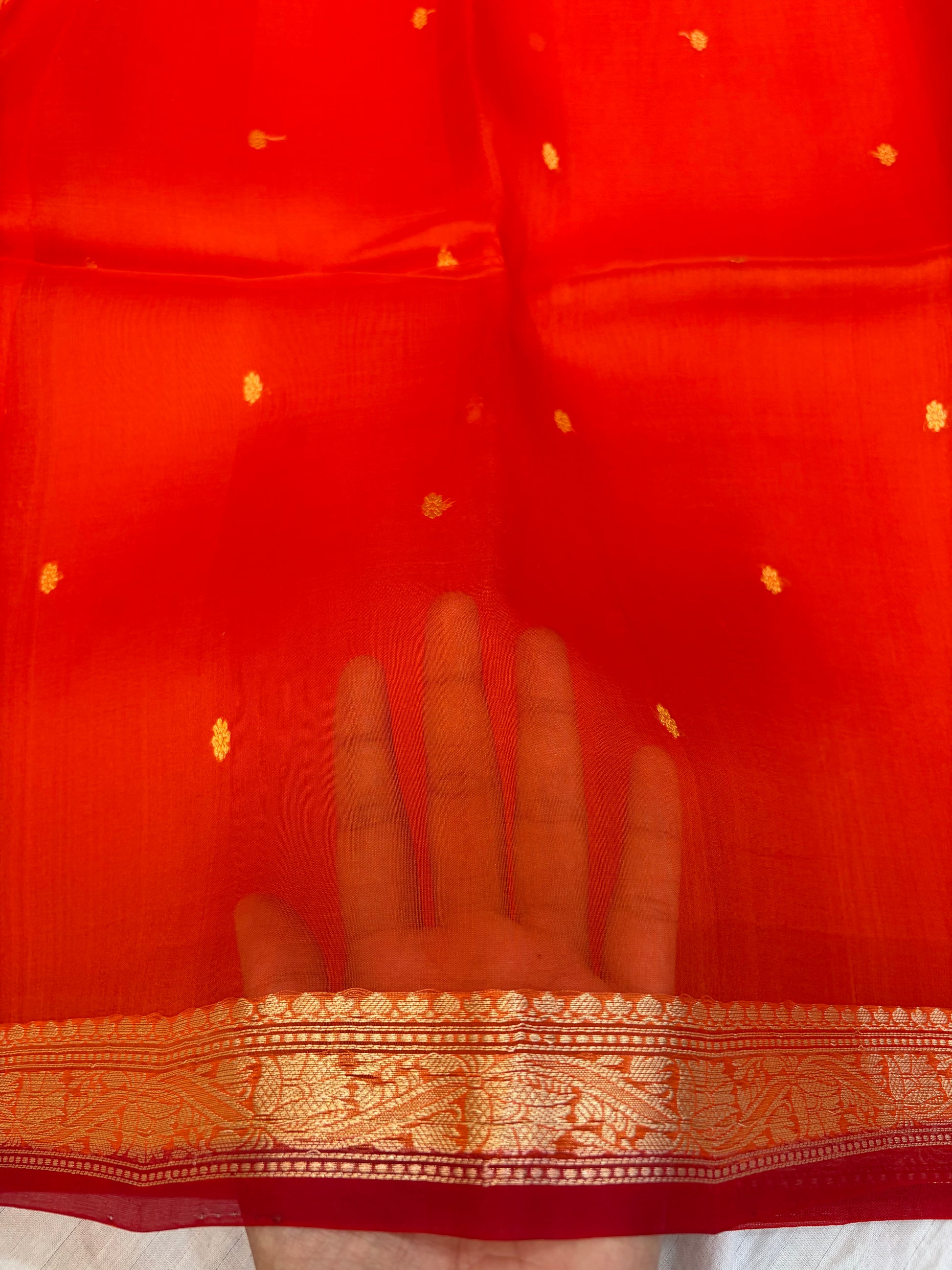 Pure handloom organza silk saree In orange colour with red piping border